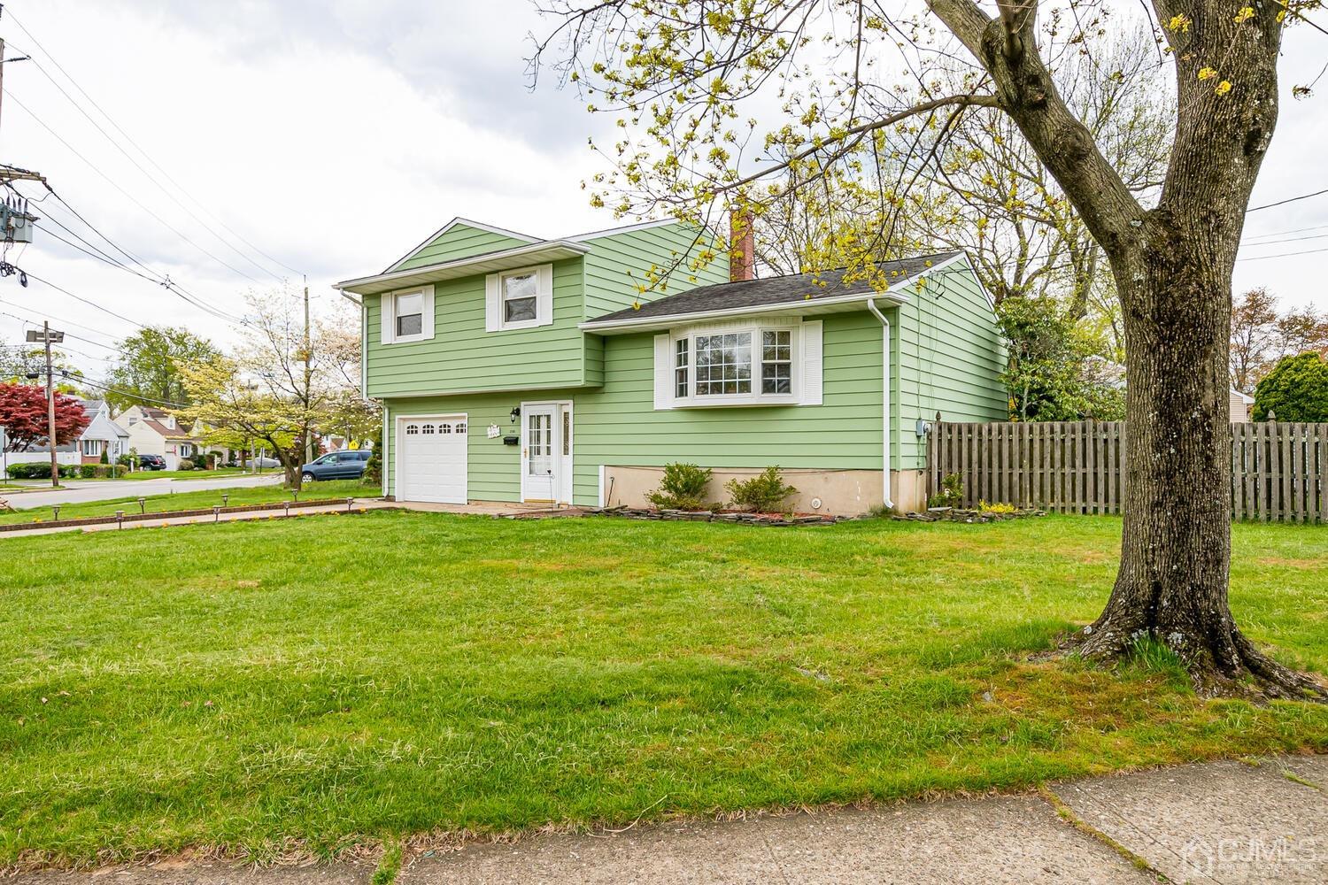 150 Vineyard Road Edison, NJ 08817 - Photo 2 of 33 a front view of a house with a yard