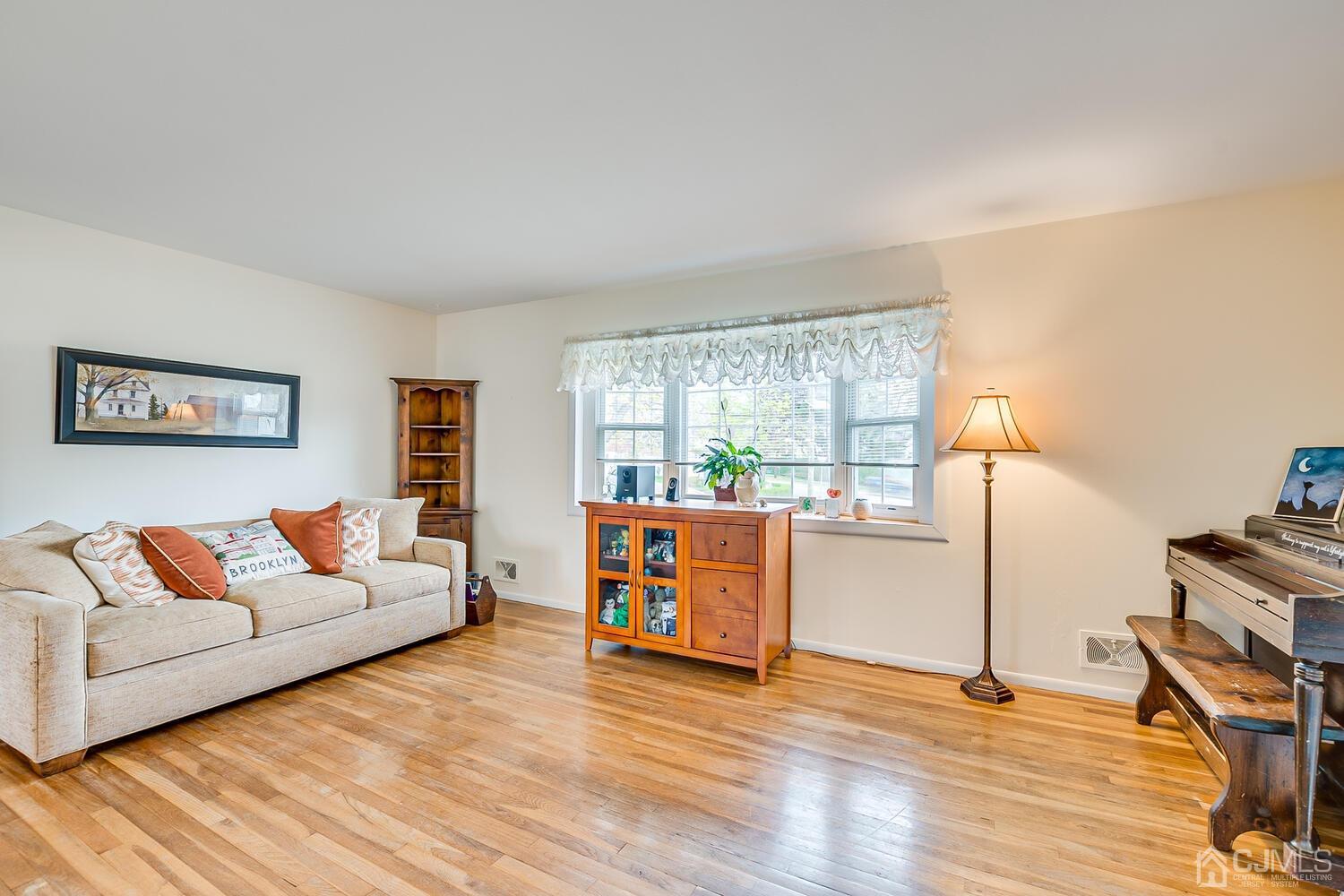 150 Vineyard Road Edison, NJ 08817 - Photo 12 of 33 a living room with furniture and a wooden floor
