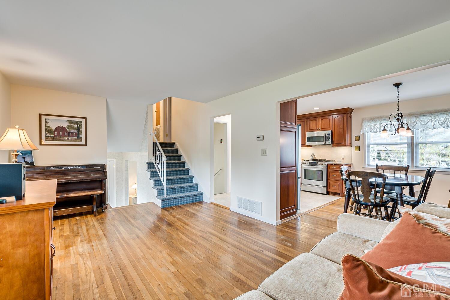 150 Vineyard Road Edison, NJ 08817 - Photo 14 of 33 a view of a livingroom with furniture and wooden floor