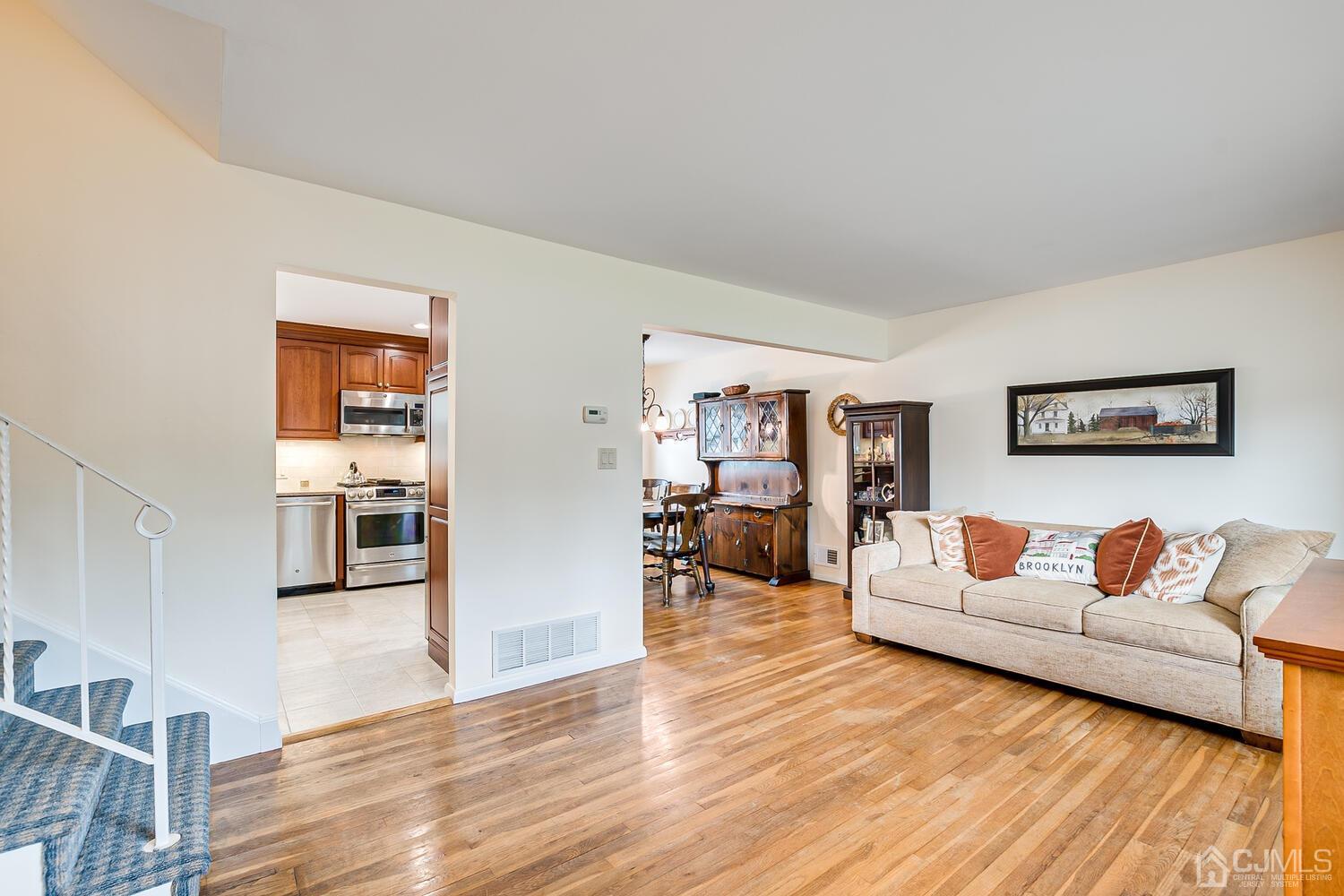 150 Vineyard Road Edison, NJ 08817 - Photo 15 of 33 a living room with furniture and wooden floor