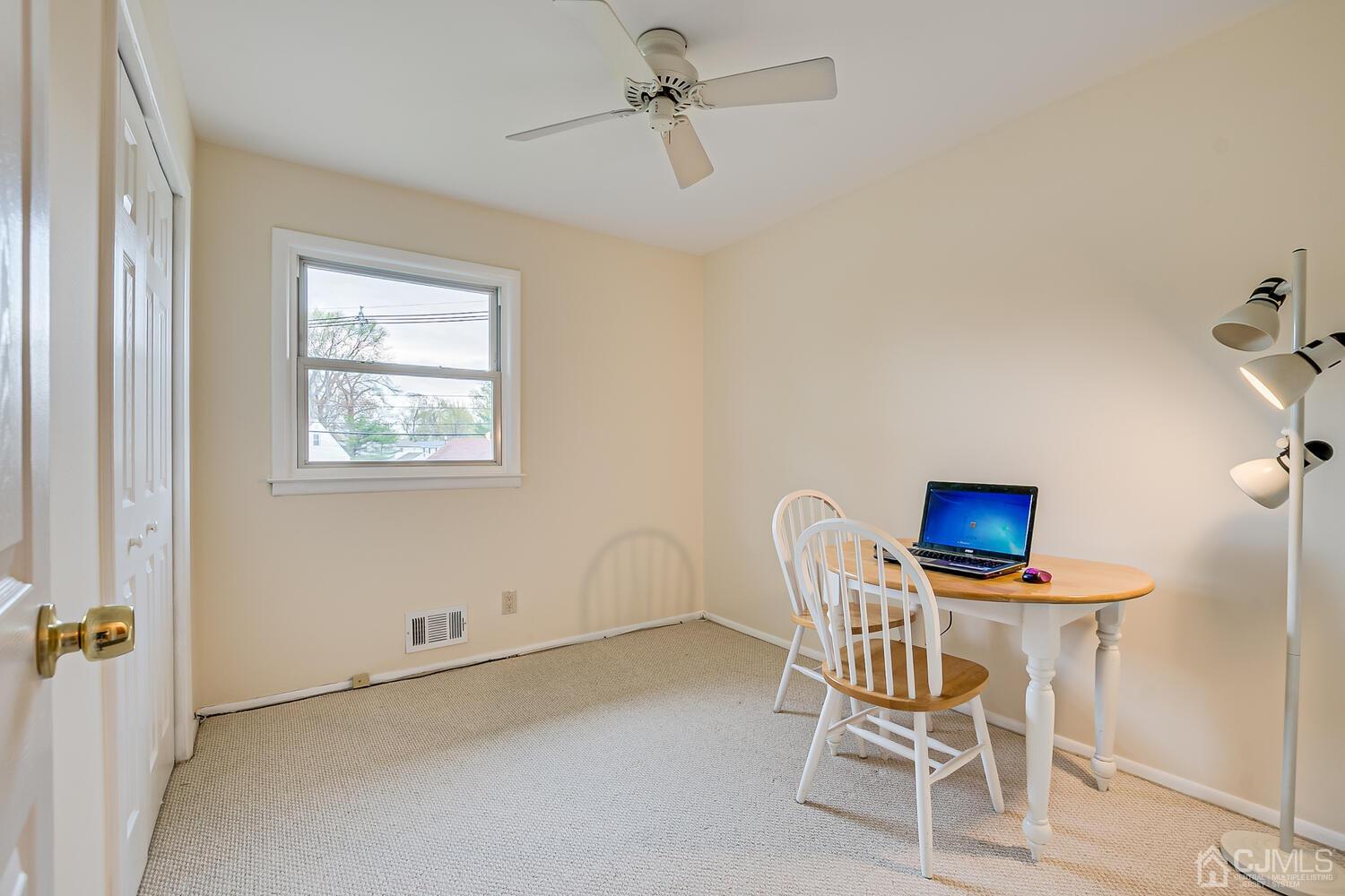 150 Vineyard Road Edison, NJ 08817 - Photo 27 of 33 a dining room with furniture and a window