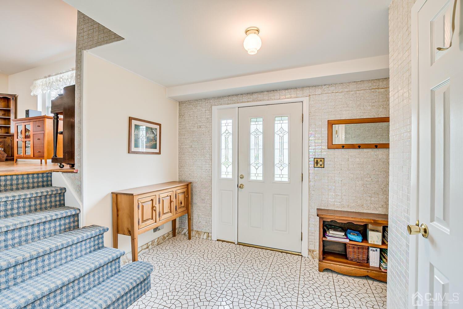 150 Vineyard Road Edison, NJ 08817 - Photo 7 of 33 a living room with furniture and a fireplace