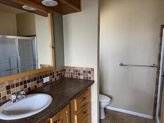 355 Colver Road, Unit 24 Talent, OR 97540 - Photo 16 of 21 a bathroom with a granite countertop sink and a mirror