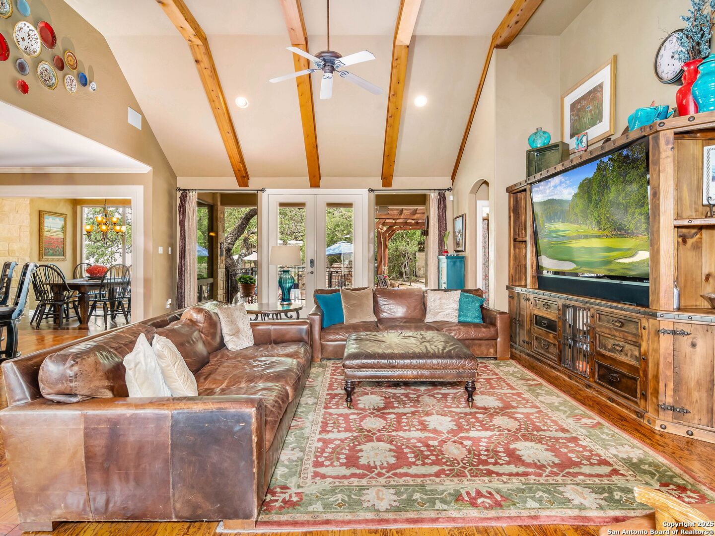 21010 Sky Ridge Avenue San Antonio, TX 78258 - Photo 11 of 70 a living room with furniture and a flat screen tv