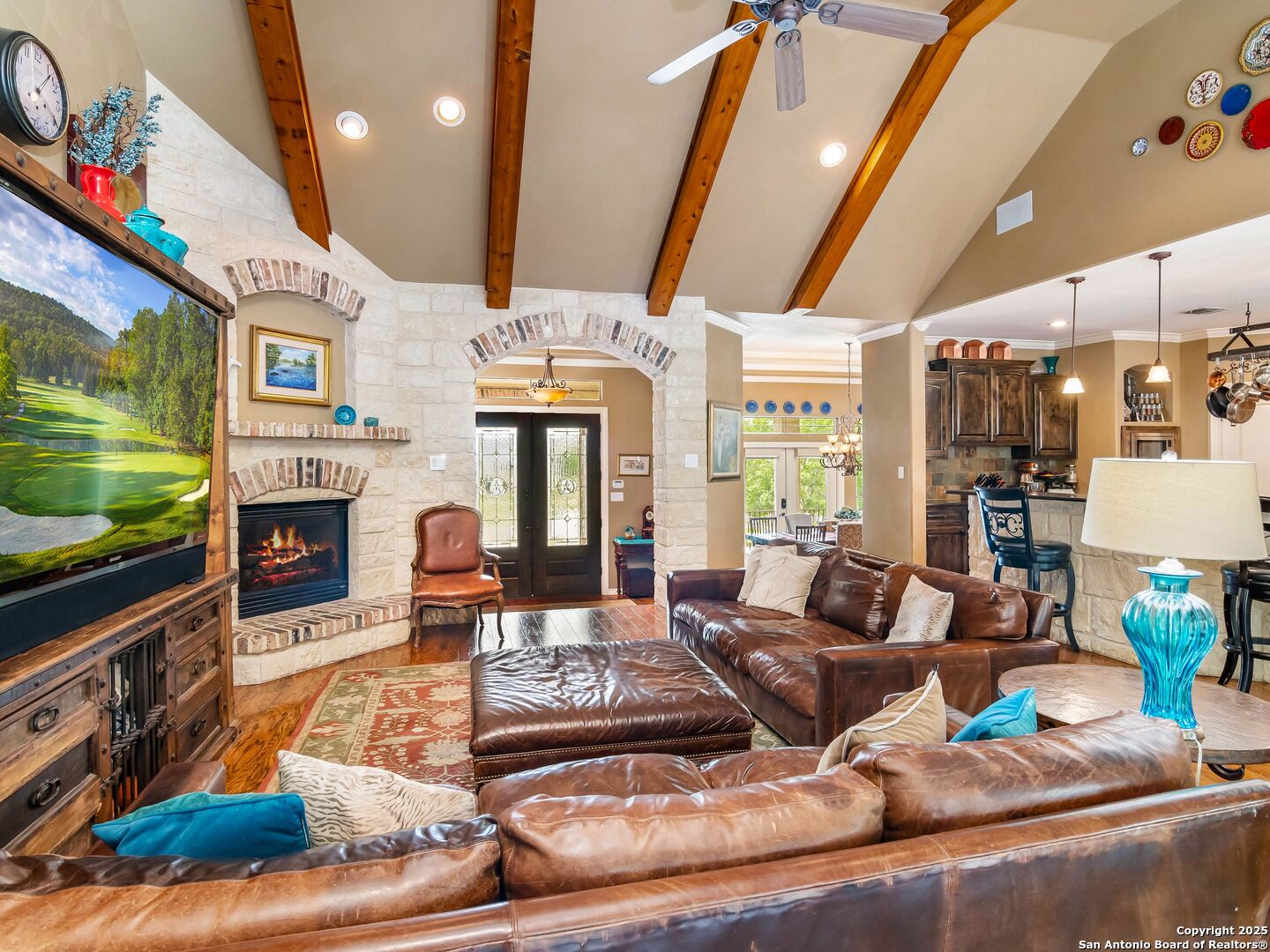 21010 Sky Ridge Avenue San Antonio, TX 78258 - Photo 14 of 70 a living room with fireplace furniture and a flat screen tv