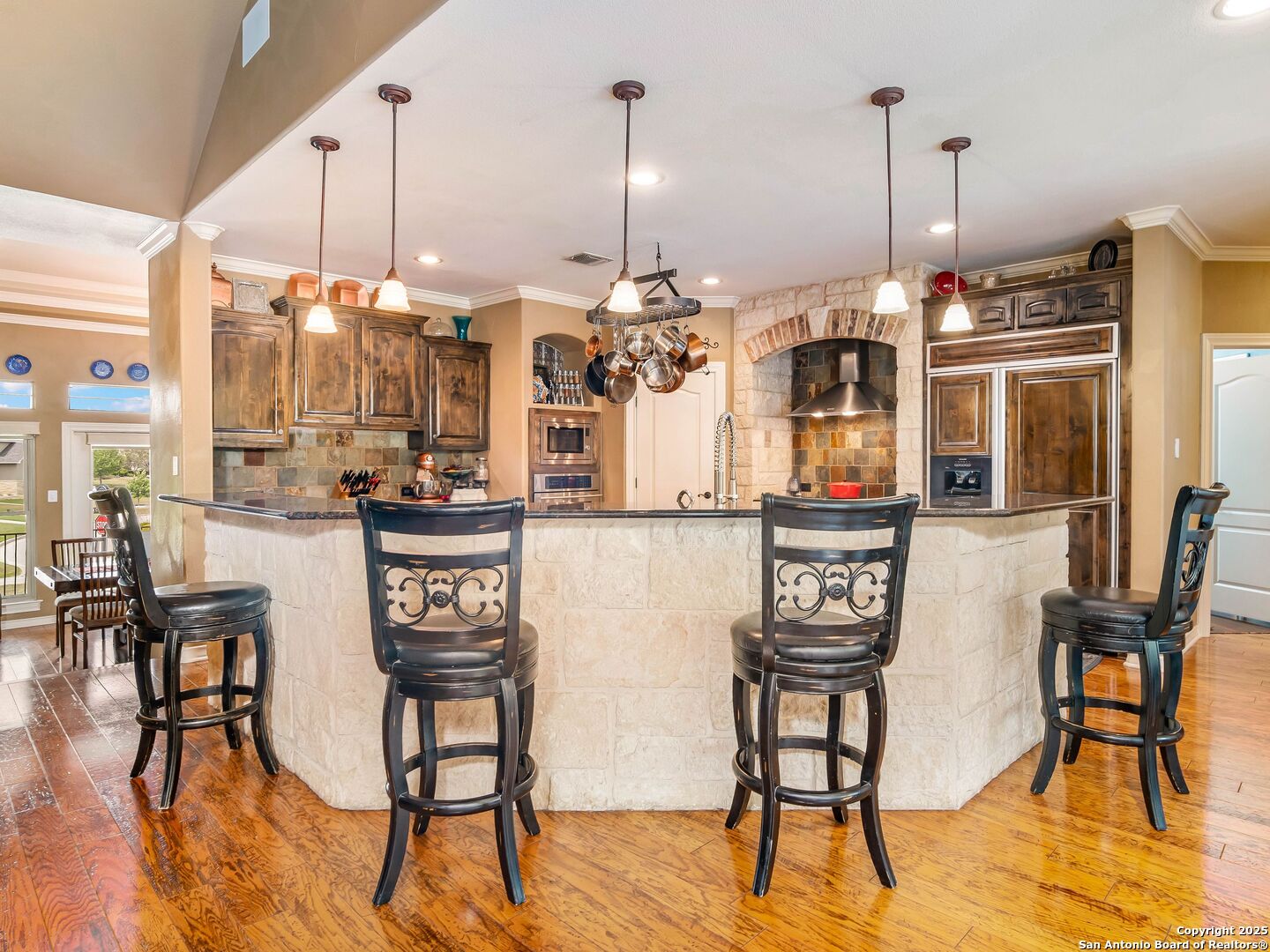21010 Sky Ridge Avenue San Antonio, TX 78258 - Photo 15 of 70 a view of a dining room with furniture window and wooden floor