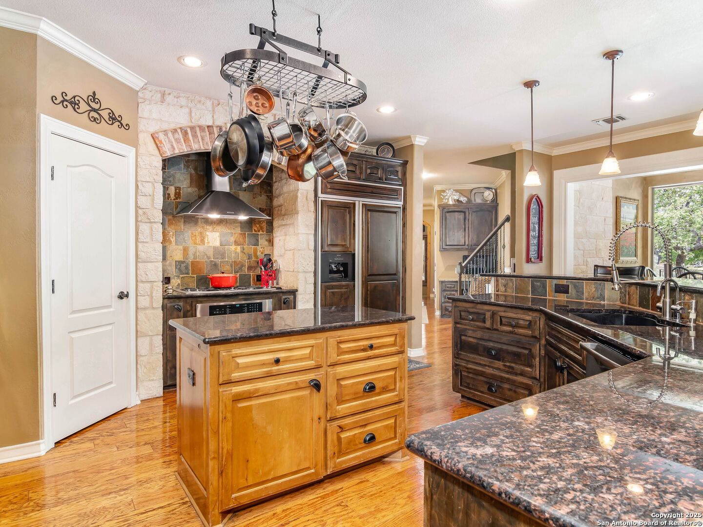 21010 Sky Ridge Avenue San Antonio, TX 78258 - Photo 17 of 70 a kitchen with stainless steel appliances granite countertop a sink and cabinets