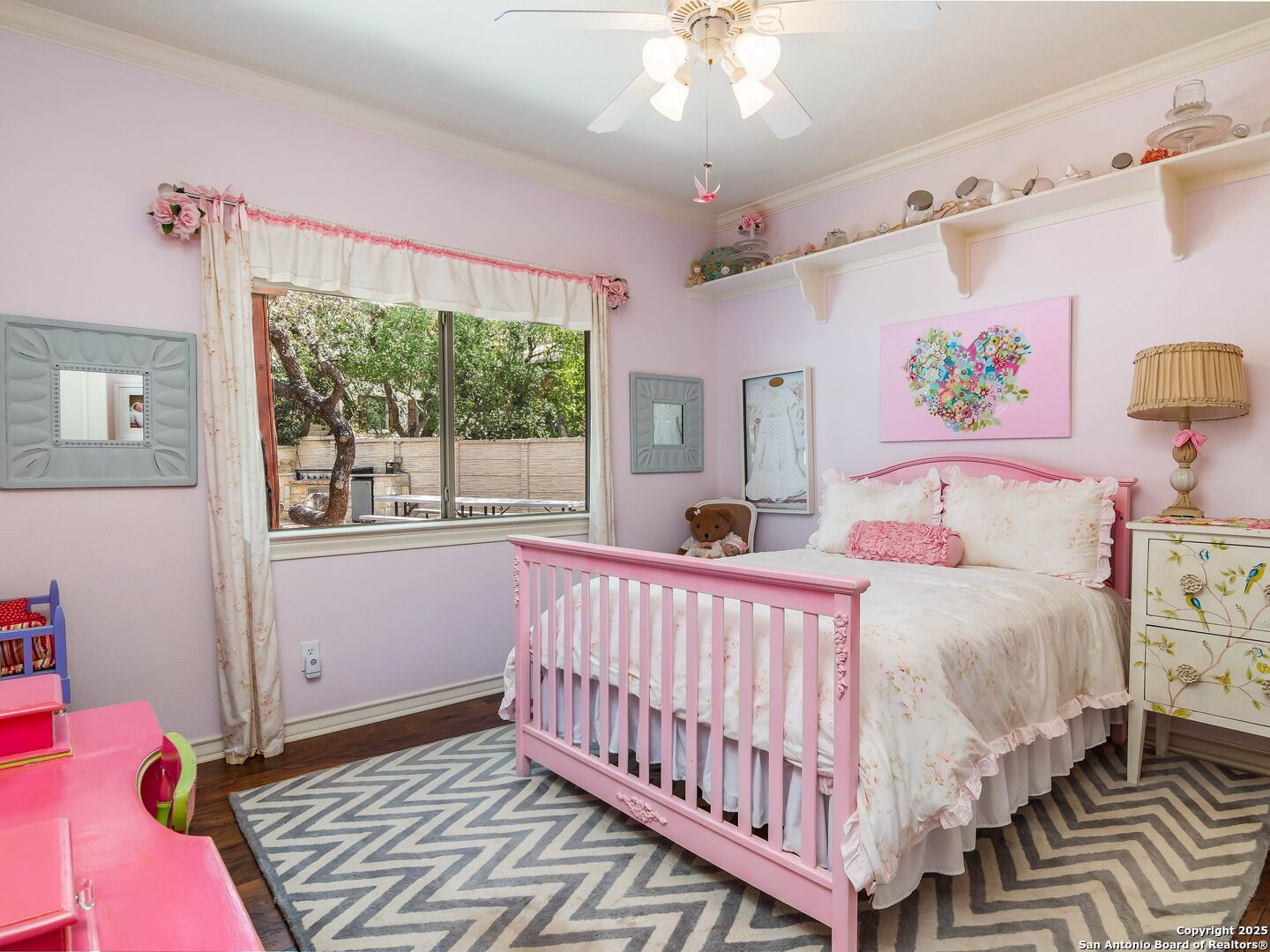 21010 Sky Ridge Avenue San Antonio, TX 78258 - Photo 24 of 70 a bed room with a bed and a window