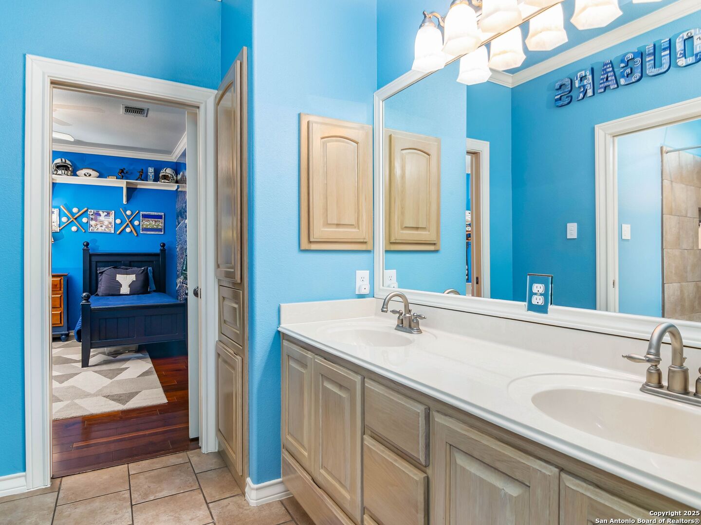 21010 Sky Ridge Avenue San Antonio, TX 78258 - Photo 29 of 70 a en suite bathroom with a sink and a mirror