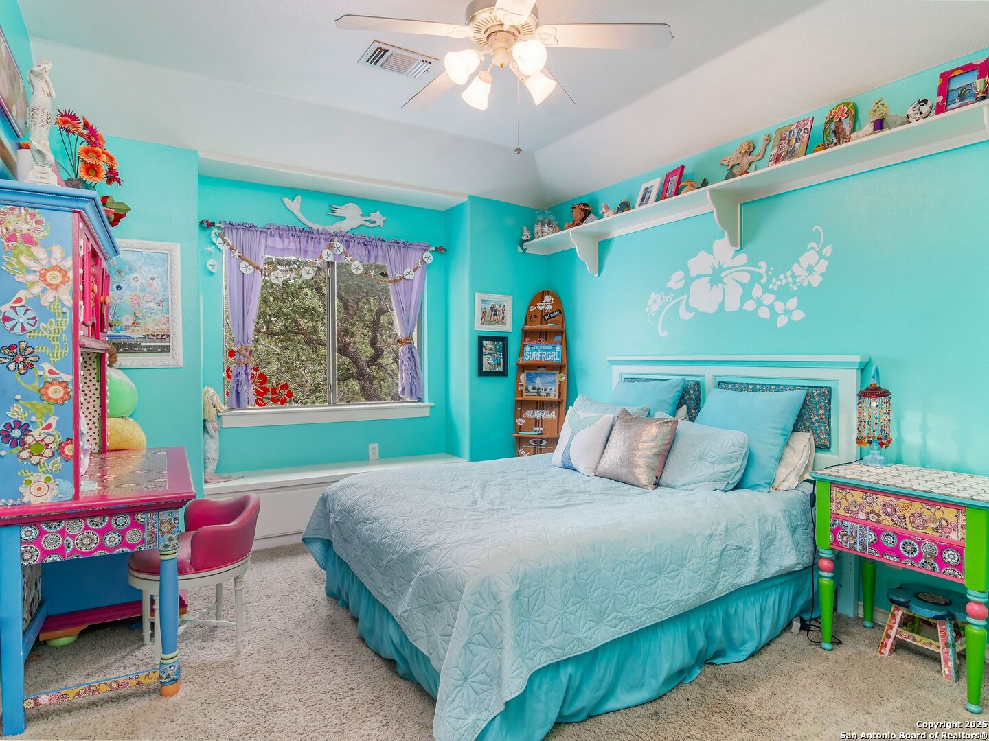 21010 Sky Ridge Avenue San Antonio, TX 78258 - Photo 31 of 70 a bedroom with a bed and a chandelier