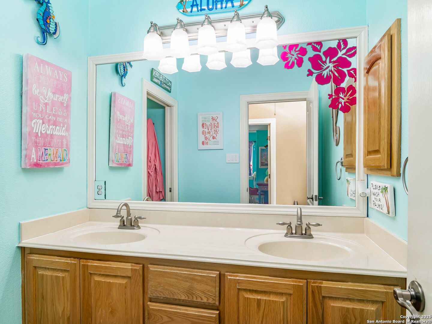 21010 Sky Ridge Avenue San Antonio, TX 78258 - Photo 32 of 70 a bathroom with a granite countertop double vanity sink and a mirror