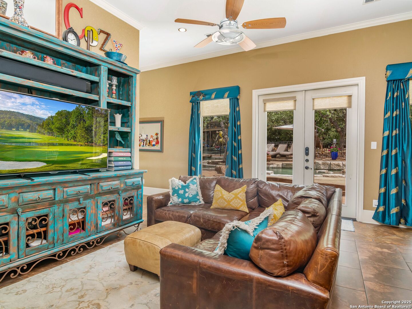 21010 Sky Ridge Avenue San Antonio, TX 78258 - Photo 35 of 70 a living room with furniture and a flat screen tv