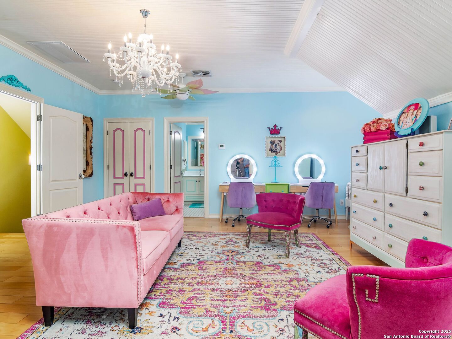 21010 Sky Ridge Avenue San Antonio, TX 78258 - Photo 41 of 70 a living room with furniture and a chandelier