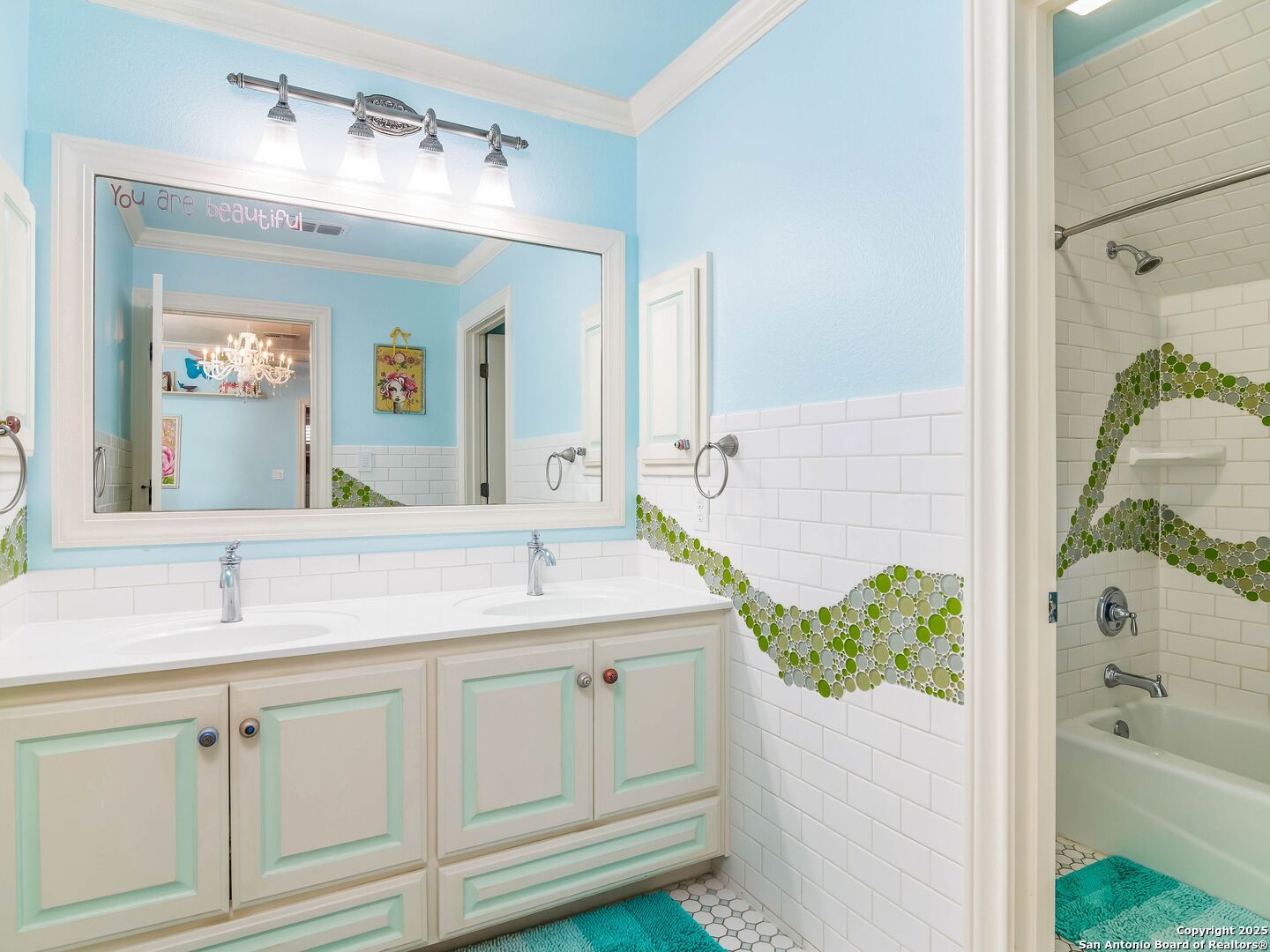 21010 Sky Ridge Avenue San Antonio, TX 78258 - Photo 42 of 70 a bathroom with a sink and a mirror