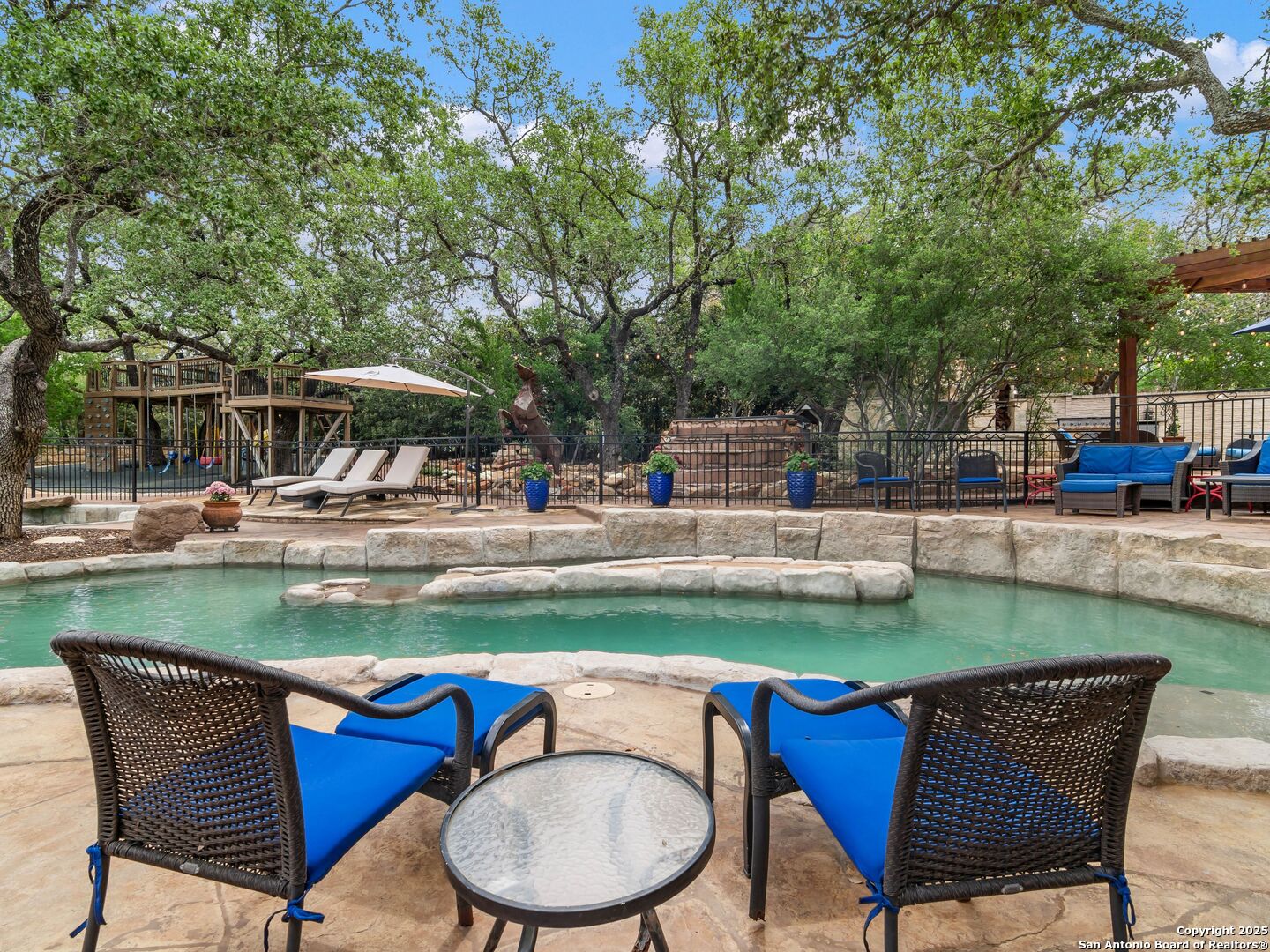 21010 Sky Ridge Avenue San Antonio, TX 78258 - Photo 48 of 70 a patio with table and chairs