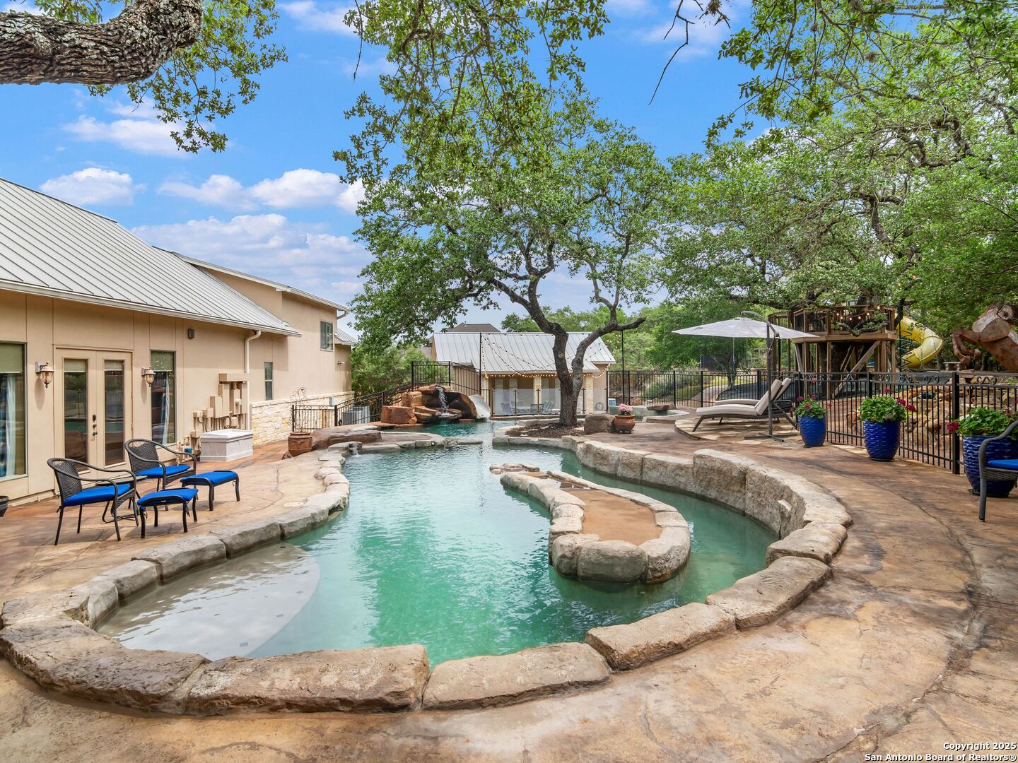 21010 Sky Ridge Avenue San Antonio, TX 78258 - Photo 50 of 70 a view of a swimming pool with outdoor seating