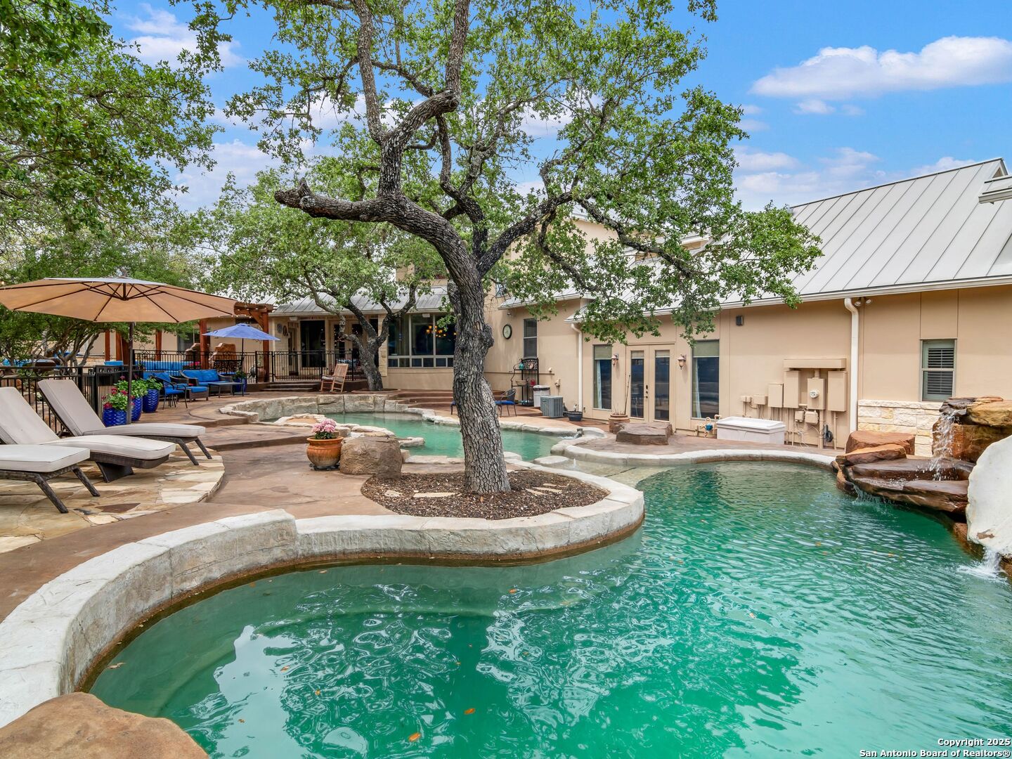 21010 Sky Ridge Avenue San Antonio, TX 78258 - Photo 51 of 70 a swimming pool with outdoor seating and yard