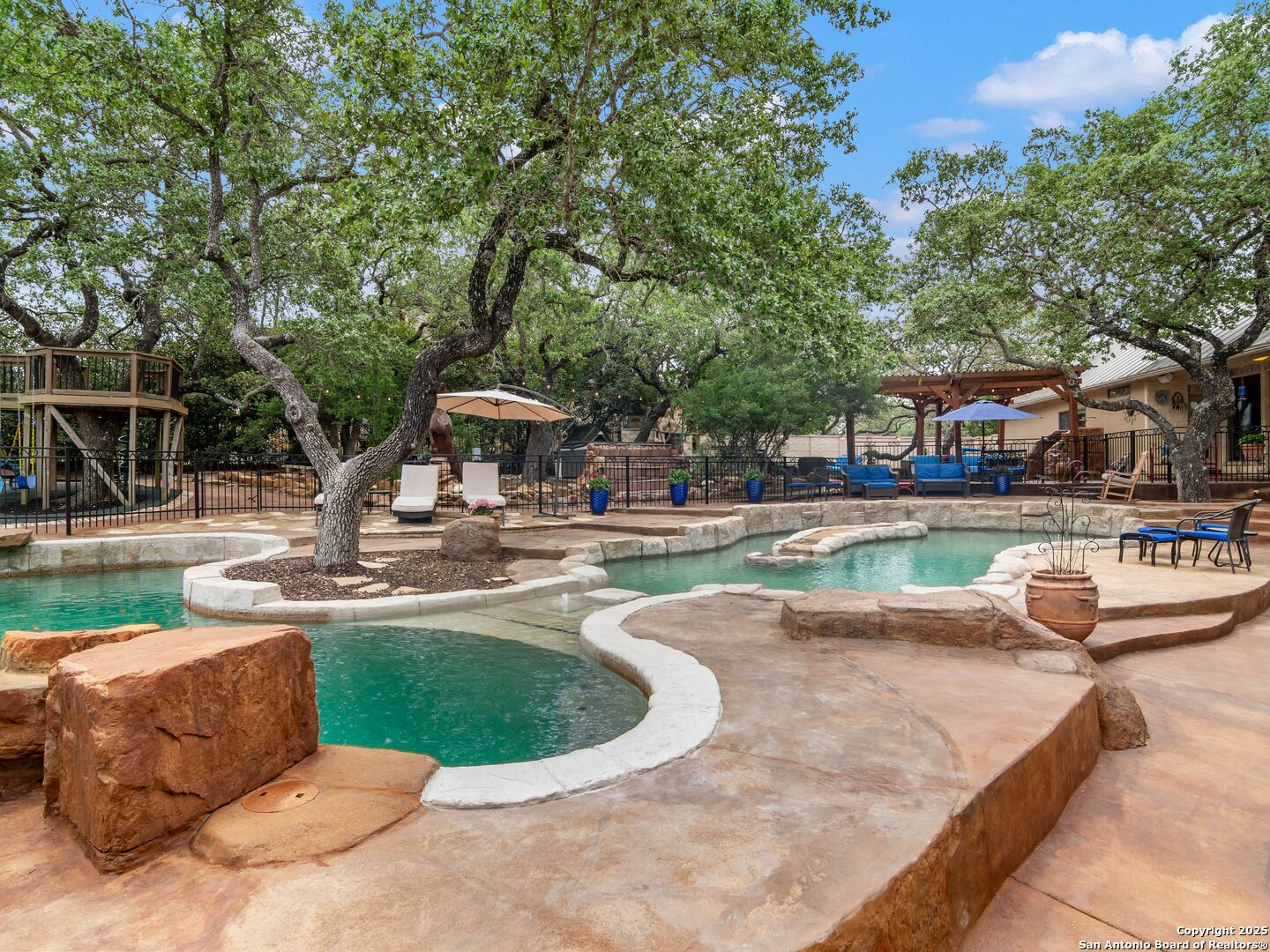 21010 Sky Ridge Avenue San Antonio, TX 78258 - Photo 52 of 70 a view of a swimming pool with outdoor seating