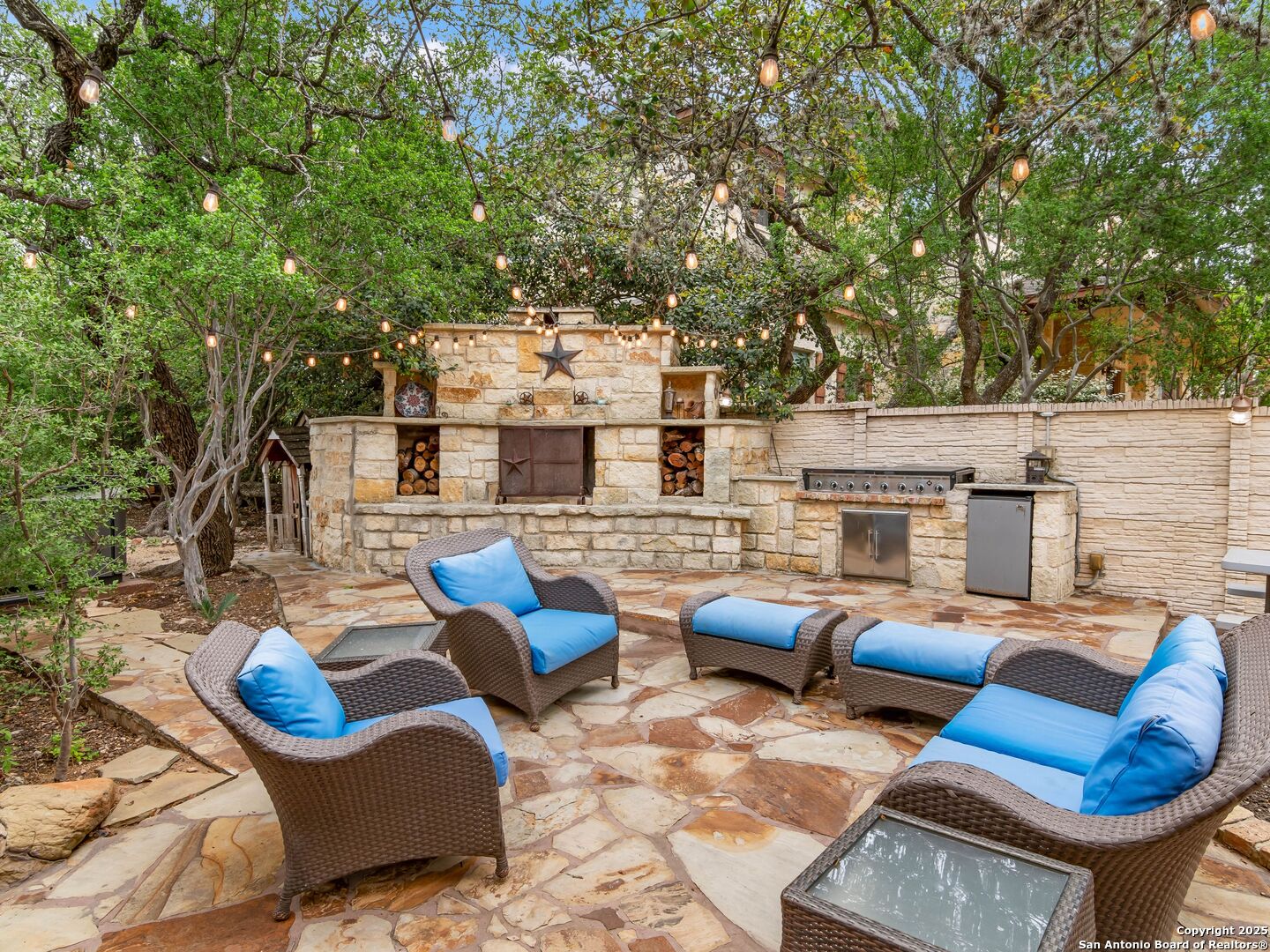 21010 Sky Ridge Avenue San Antonio, TX 78258 - Photo 57 of 70 a view of a patio with couches chairs and a fire pit