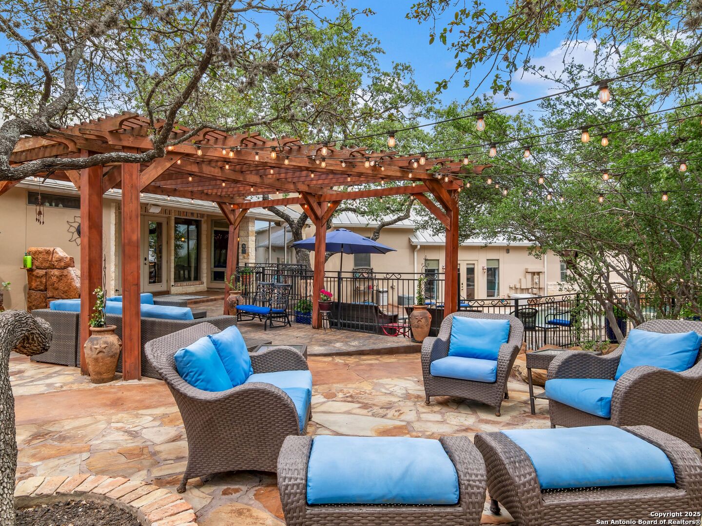 21010 Sky Ridge Avenue San Antonio, TX 78258 - Photo 58 of 70 a outdoor space with patio furniture and a fireplace