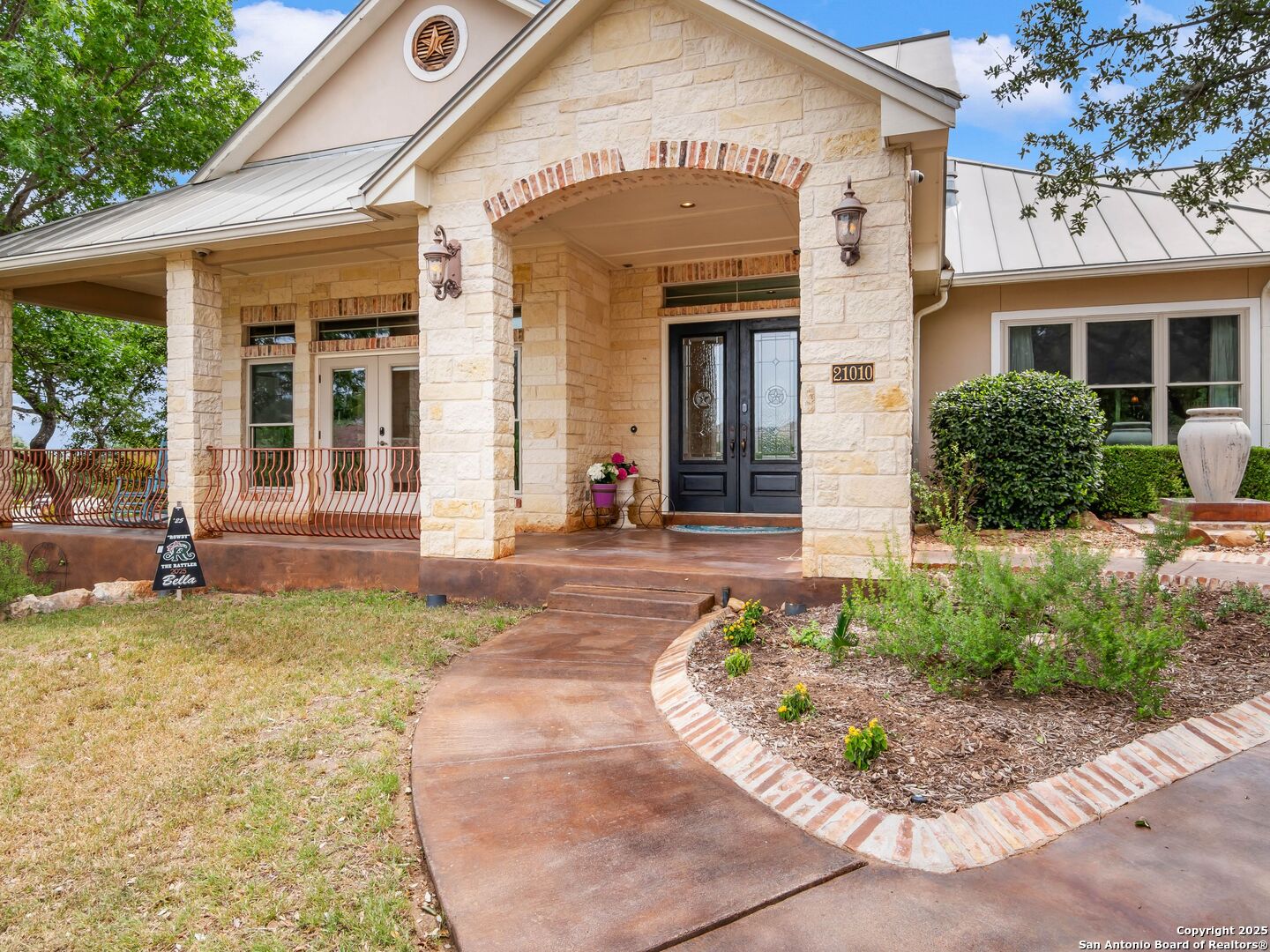 21010 Sky Ridge Avenue San Antonio, TX 78258 - Photo 6 of 70 a front view of a house with garden