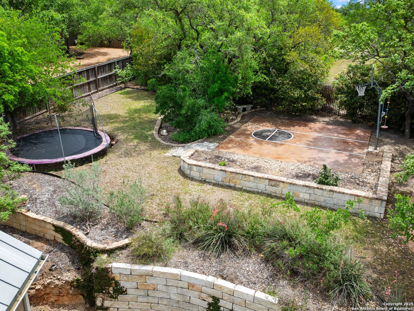 21010 Sky Ridge Avenue San Antonio, TX 78258 - Photo 66 of 70 a backyard of a house with a yard and outdoor seating