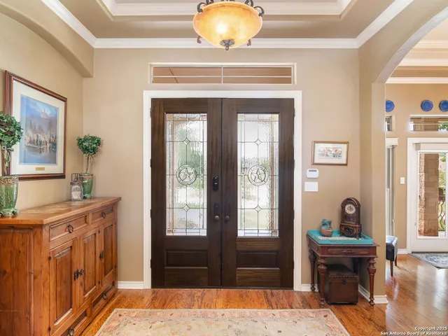 a living room with fireplace furniture and a flat screen tv