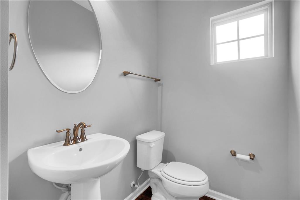 100 Arbor Trail Drive McKees Rocks, PA 15136 - Photo 11 of 22 a white toilet sitting next to a bathroom sink