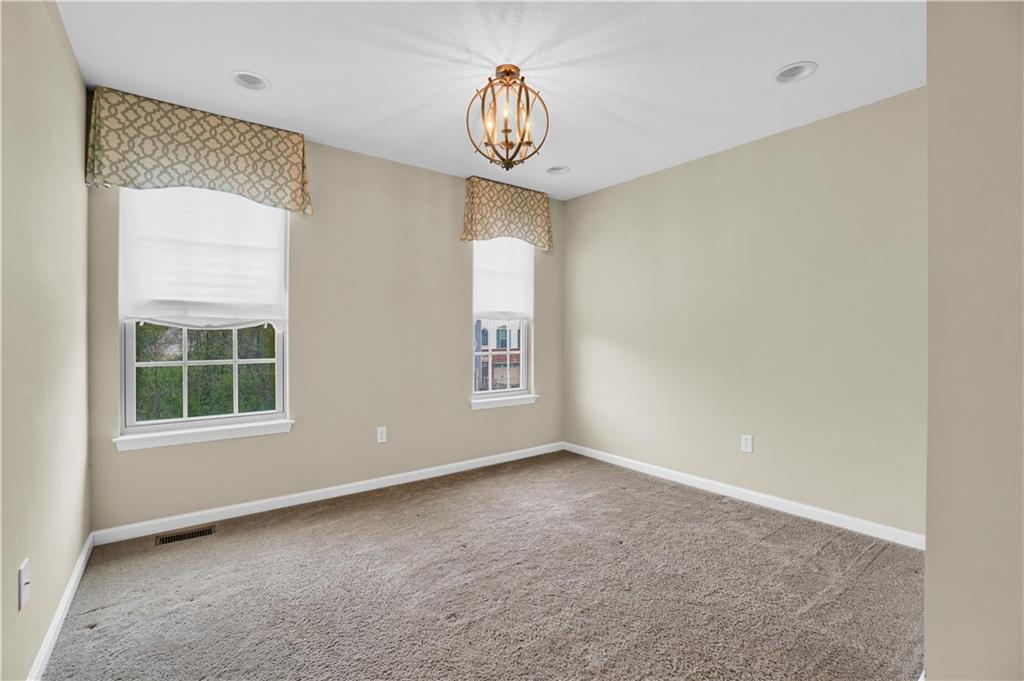 100 Arbor Trail Drive McKees Rocks, PA 15136 - Photo 12 of 22 an empty room with windows and fan