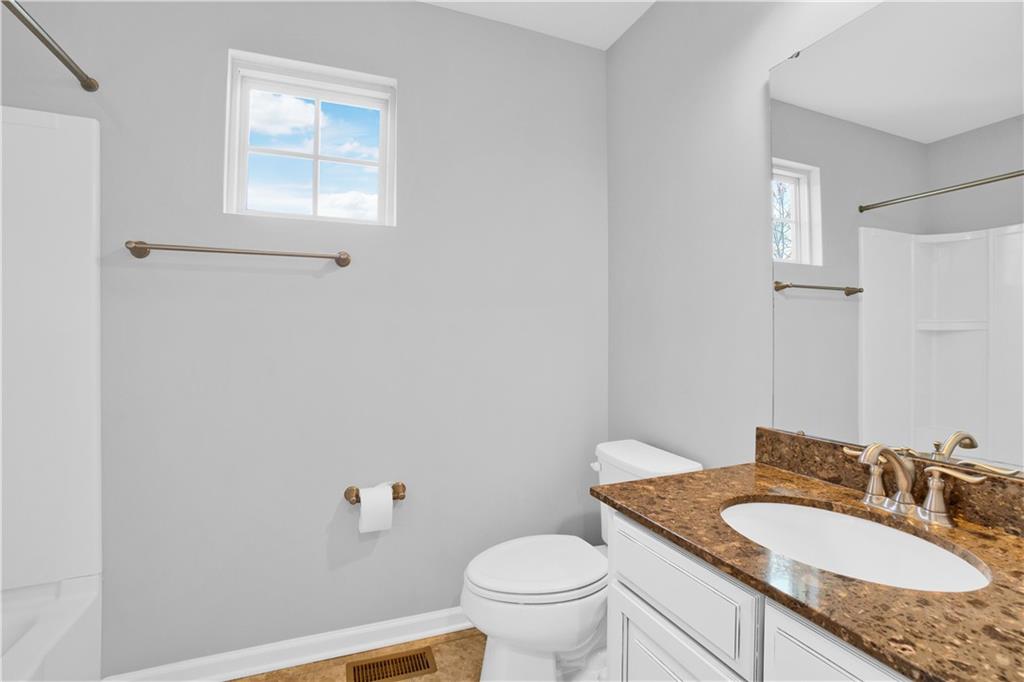 100 Arbor Trail Drive McKees Rocks, PA 15136 - Photo 14 of 22 a bathroom with a granite countertop sink a mirror and a toilet