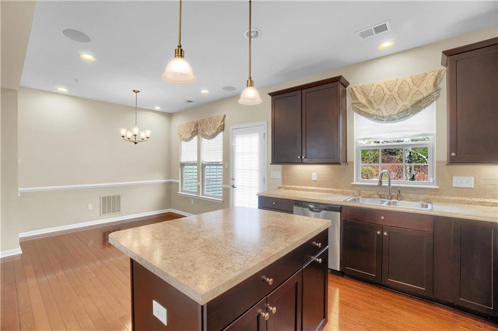 100 Arbor Trail Drive McKees Rocks, PA 15136 - Photo 8 of 22 a kitchen with a sink a center island and a window