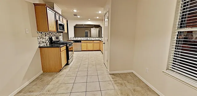 a view of a kitchen with a sink