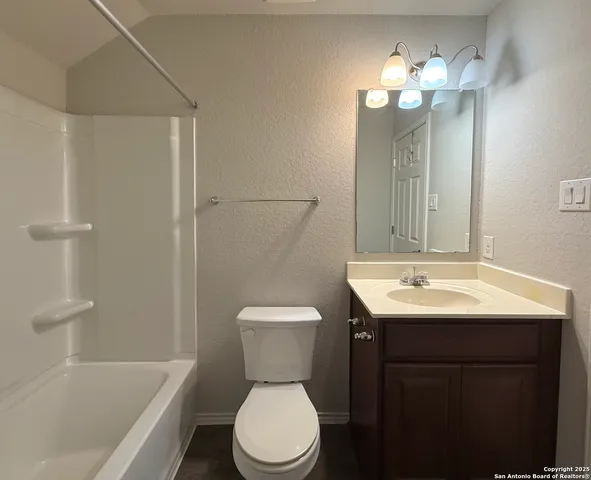 a bathroom with a toilet a sink and a bathtub