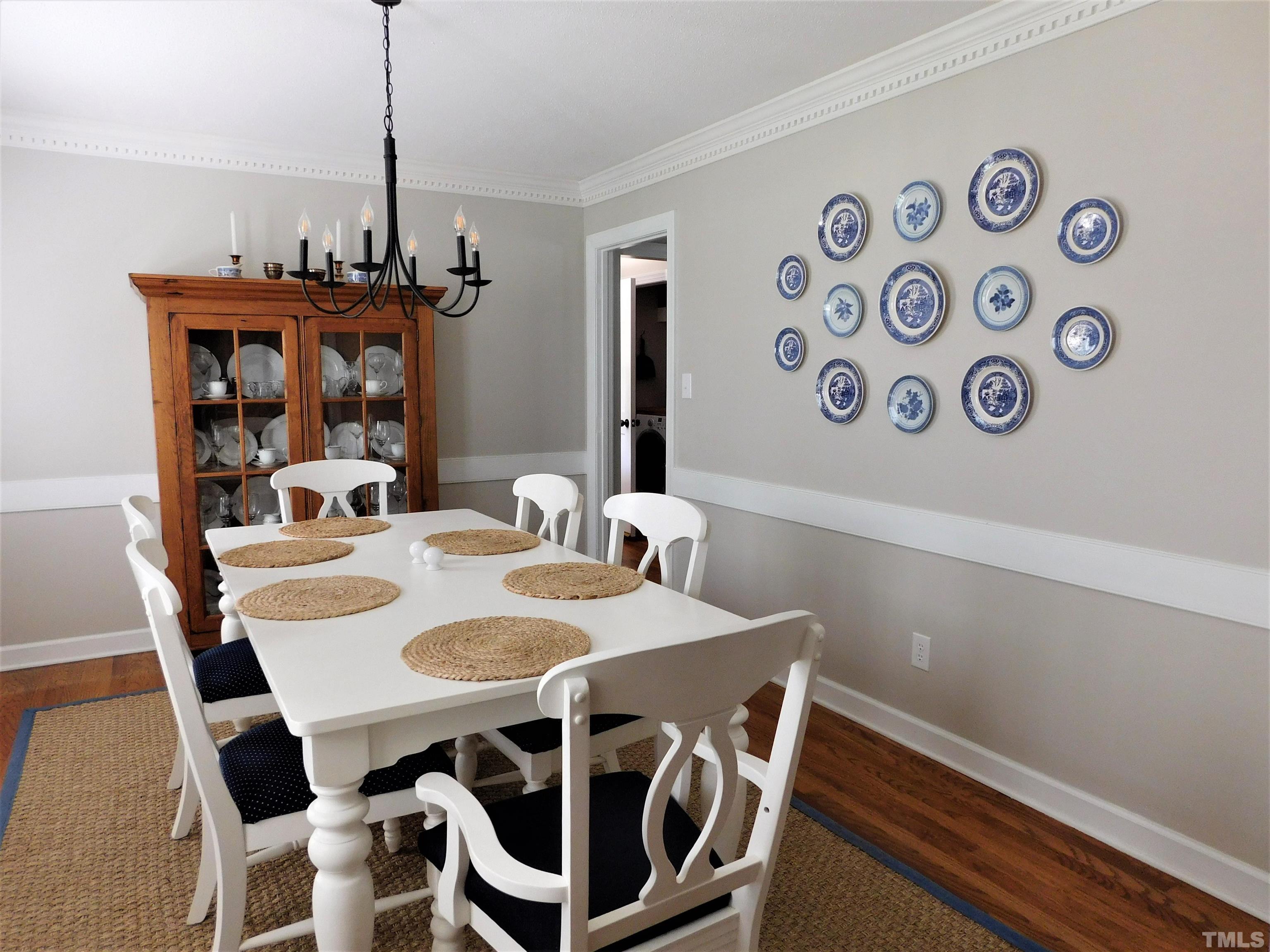 11417 Pacesferry Drive Raleigh, NC 27614 - Photo 13 of 39 a view of a dining room with furniture and wooden floor