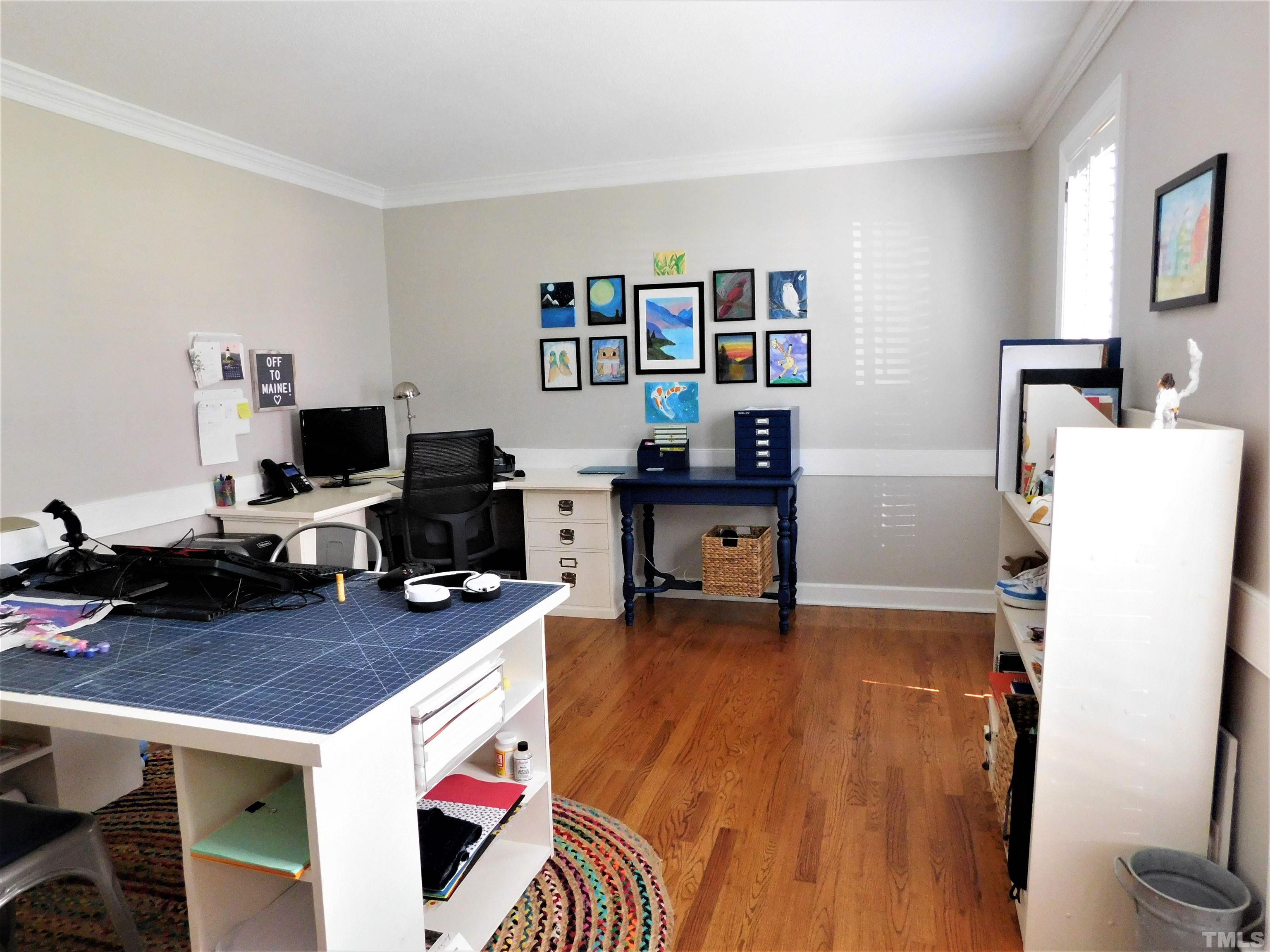 11417 Pacesferry Drive Raleigh, NC 27614 - Photo 20 of 39 a room with furniture and a flat screen tv