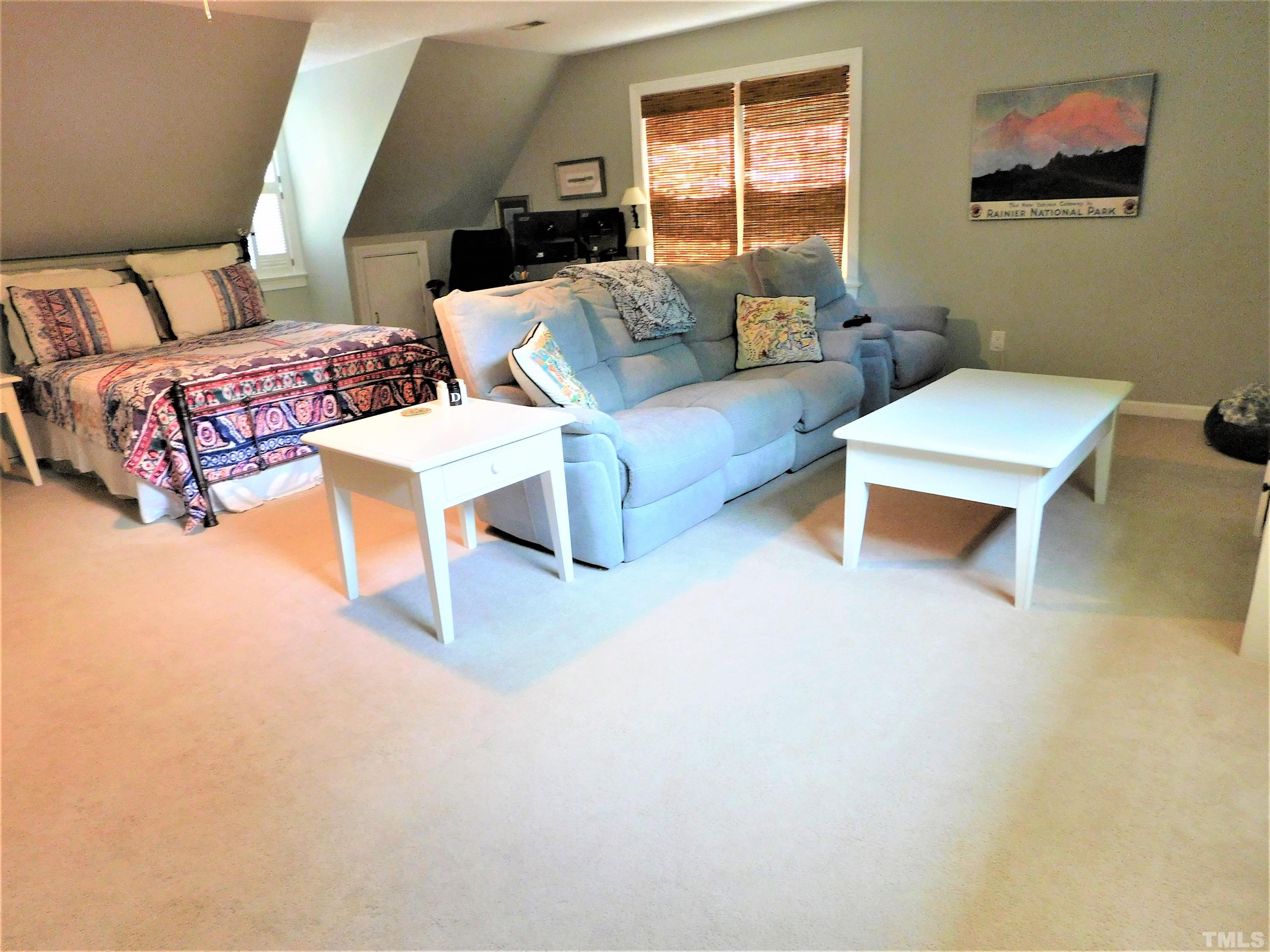 11417 Pacesferry Drive Raleigh, NC 27614 - Photo 26 of 39 a living room with furniture and a large window