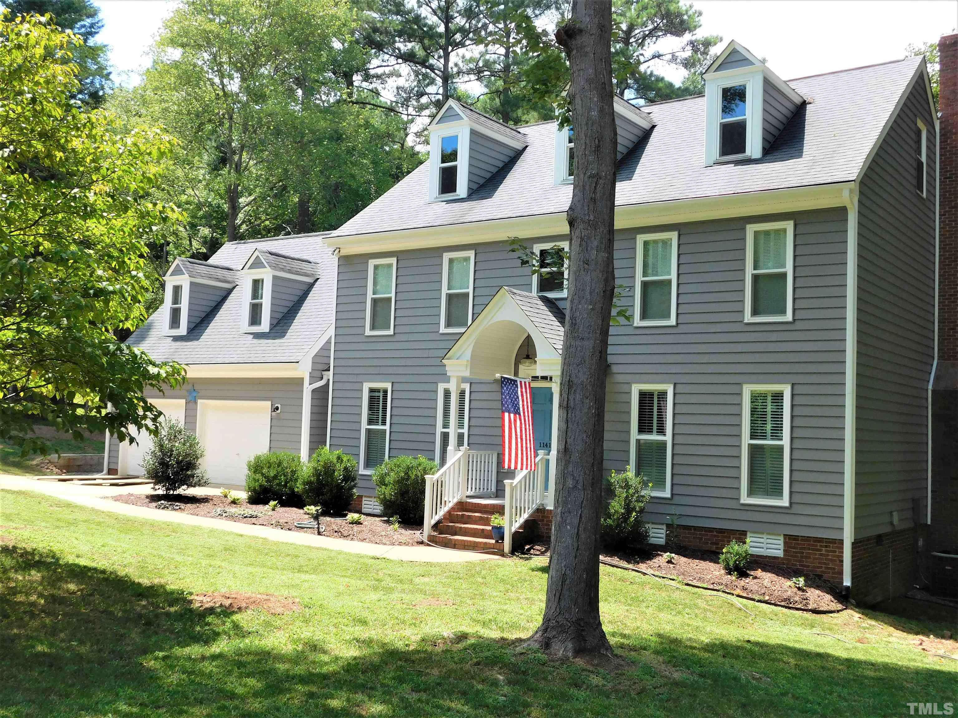 11417 Pacesferry Drive Raleigh, NC 27614 - Photo 33 of 39 a front view of a house with garden