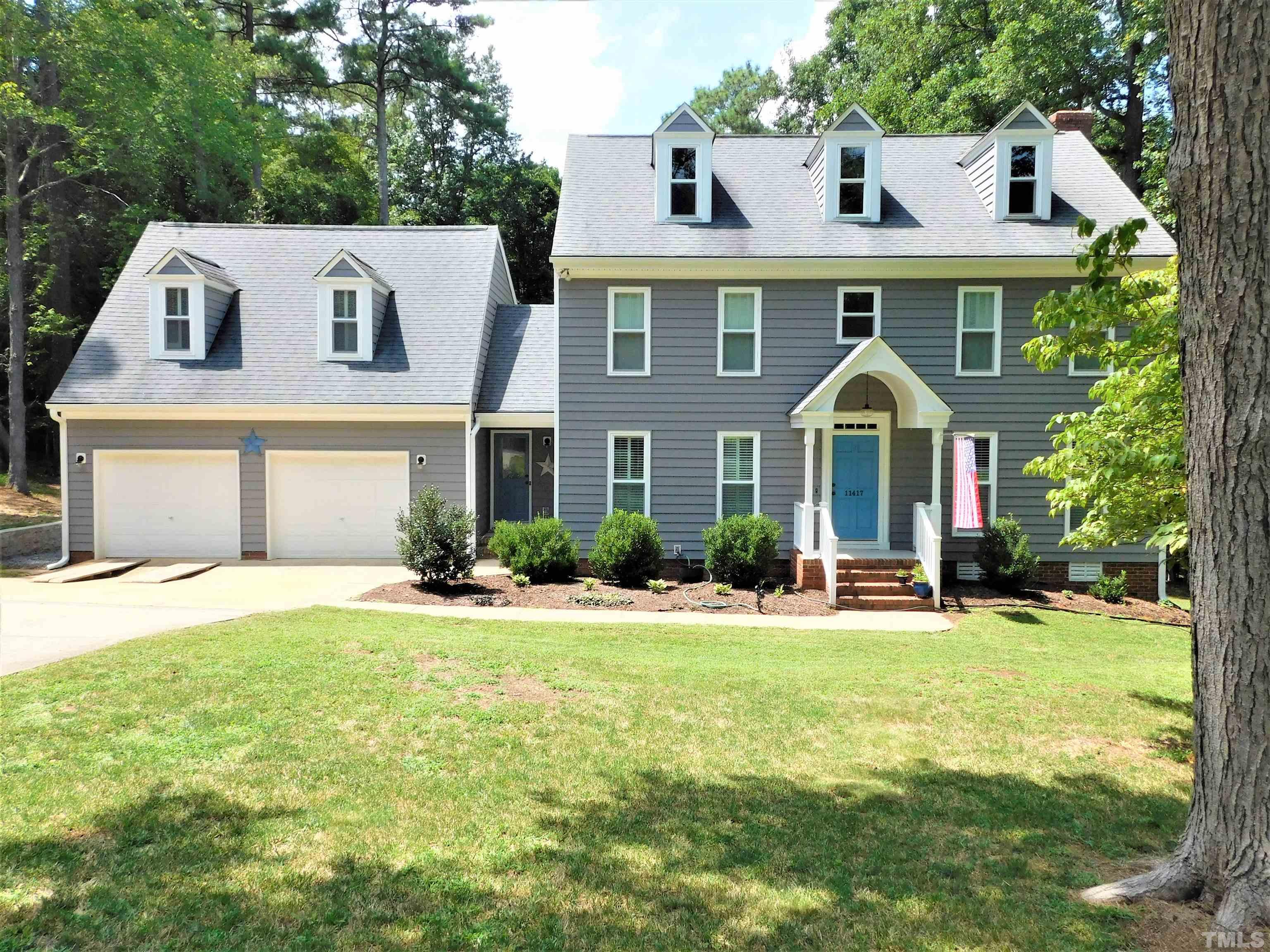 11417 Pacesferry Drive Raleigh, NC 27614 - Photo 35 of 39 a front view of a house with yard and green space
