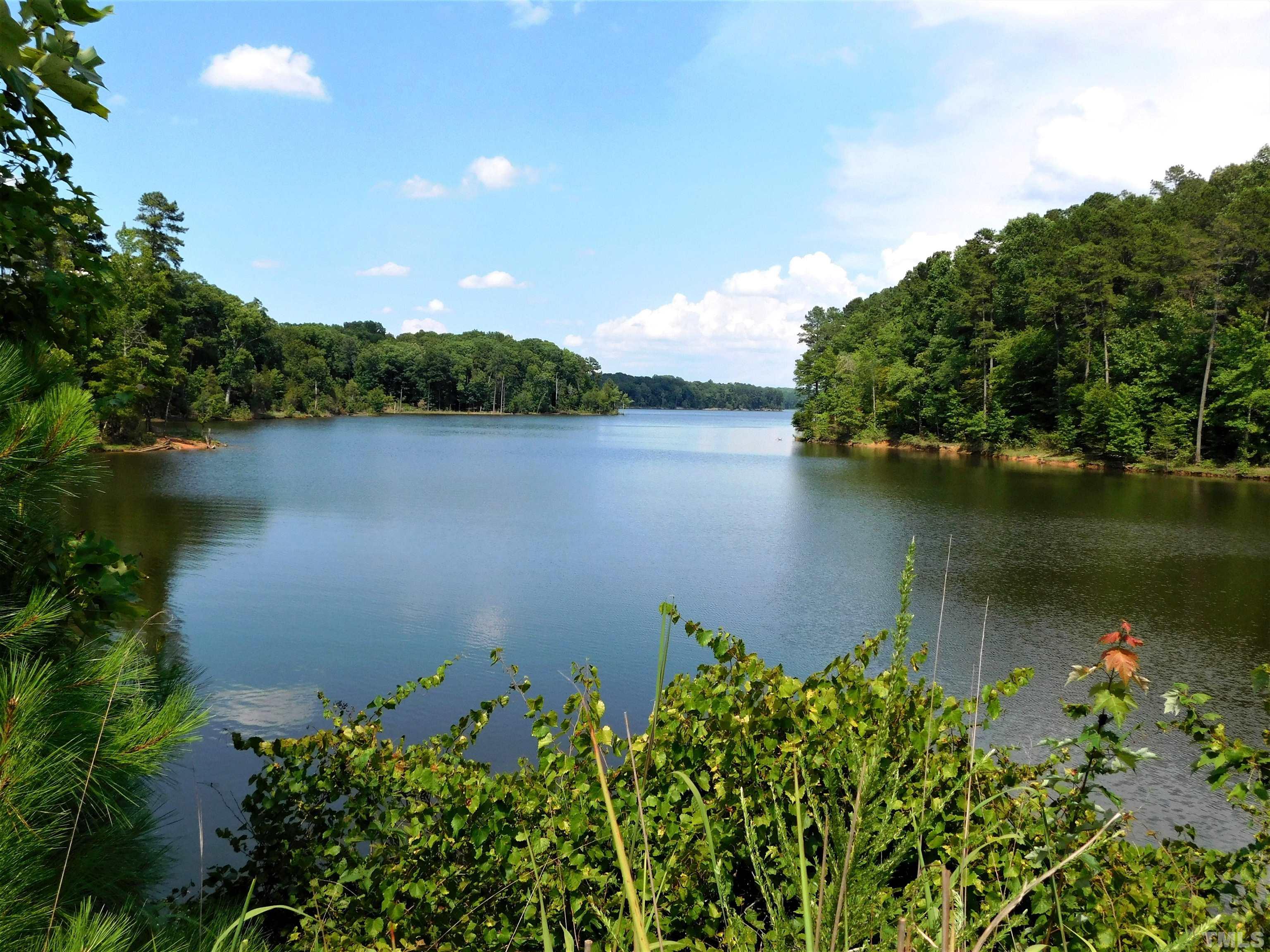 11417 Pacesferry Drive Raleigh, NC 27614 - Photo 39 of 39 an aerial view of a houses with a lake view