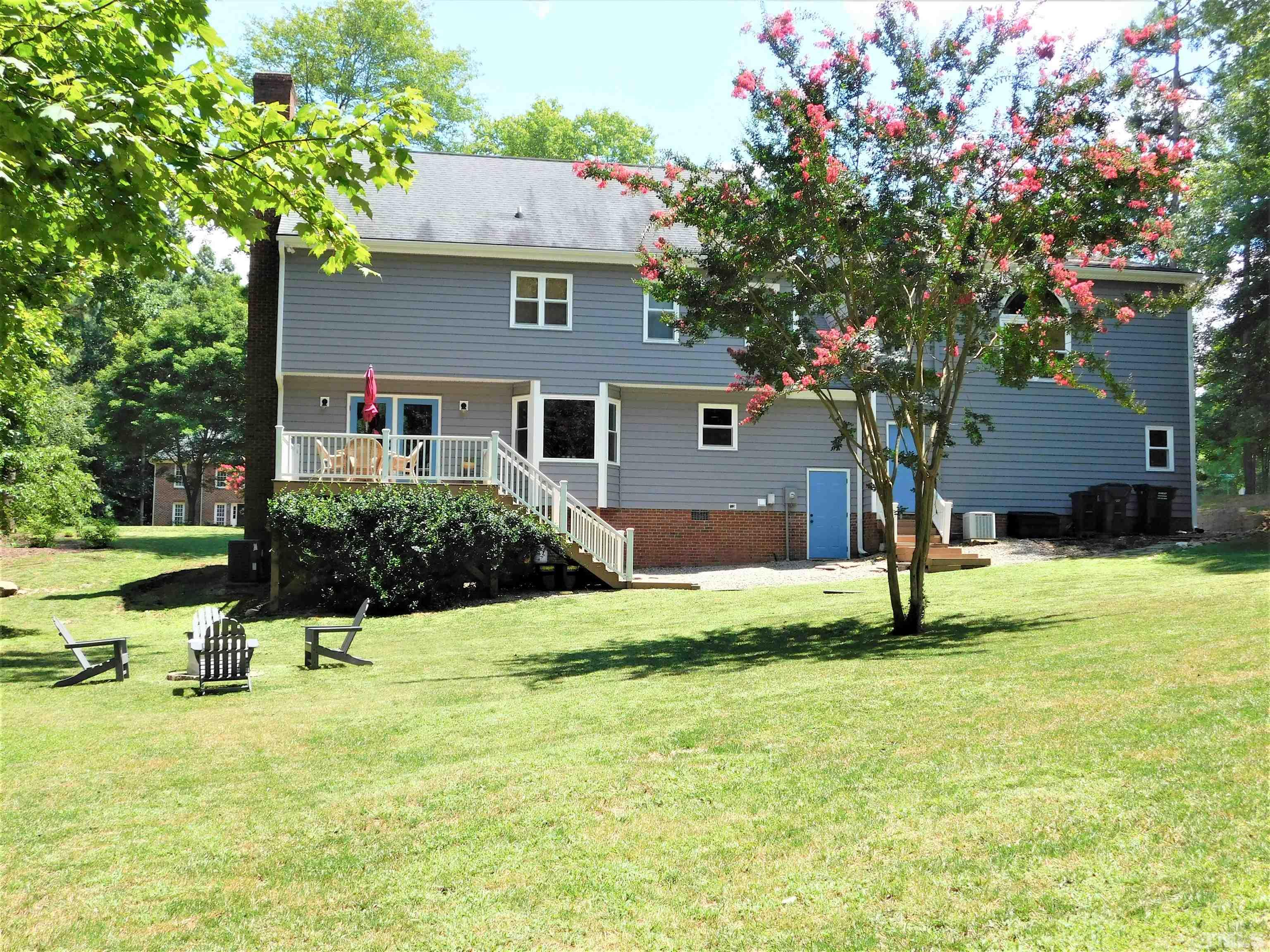 11417 Pacesferry Drive Raleigh, NC 27614 - Photo 4 of 39 a house view with a garden space