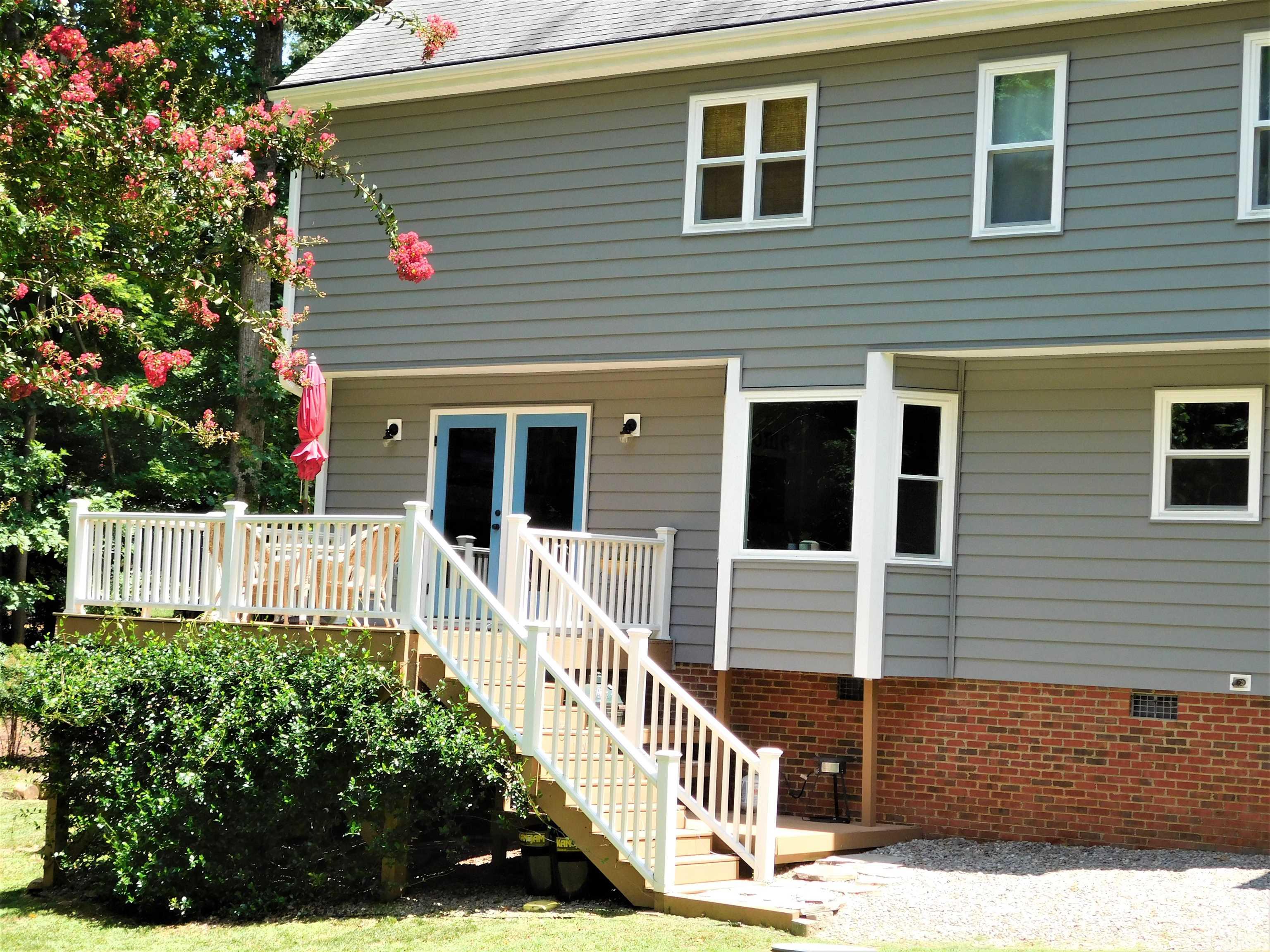 11417 Pacesferry Drive Raleigh, NC 27614 - Photo 5 of 39 a front view of a house with wooden stairs