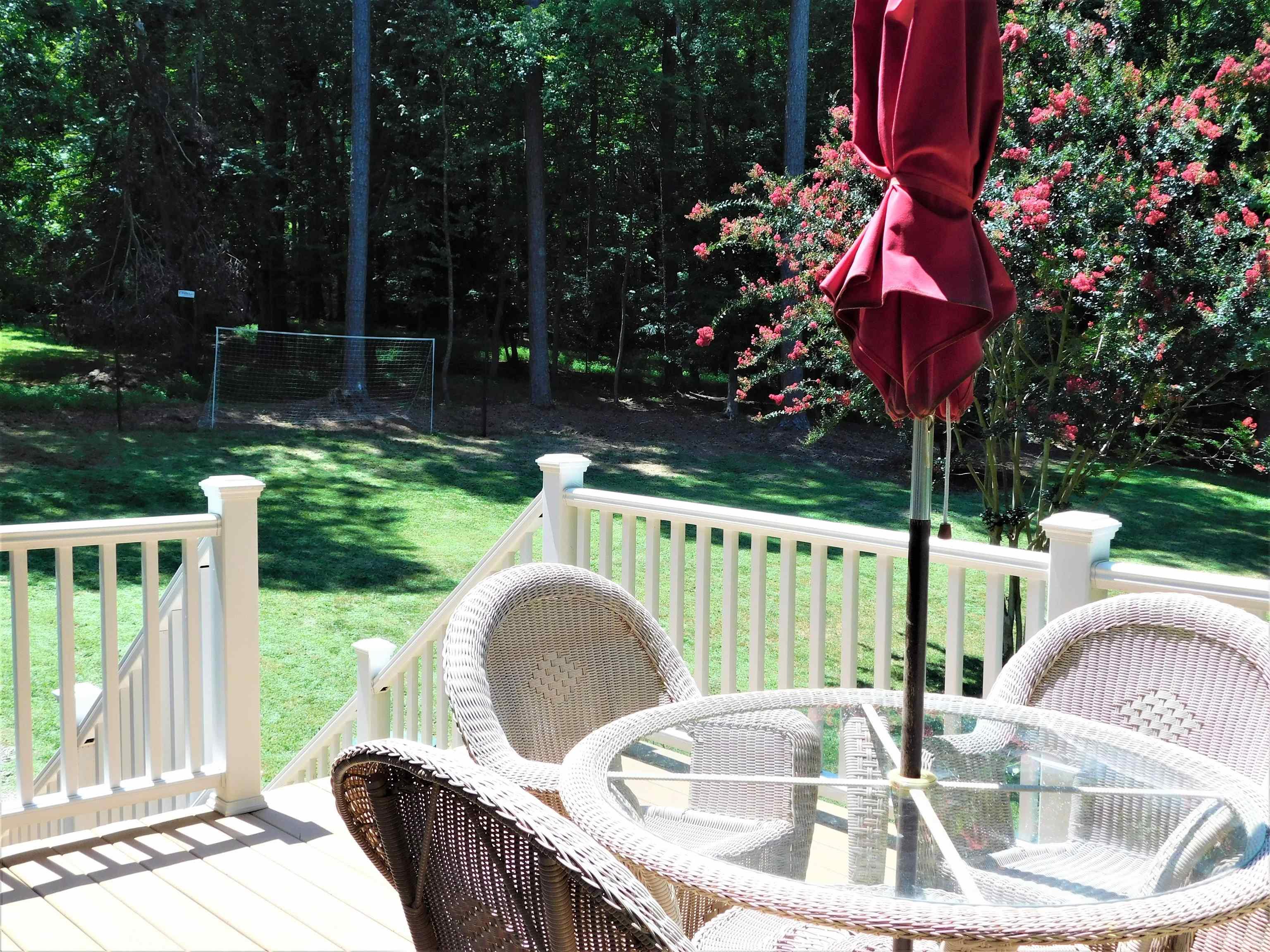 11417 Pacesferry Drive Raleigh, NC 27614 - Photo 7 of 39 a view of backyard with swimming pool and outdoor seating