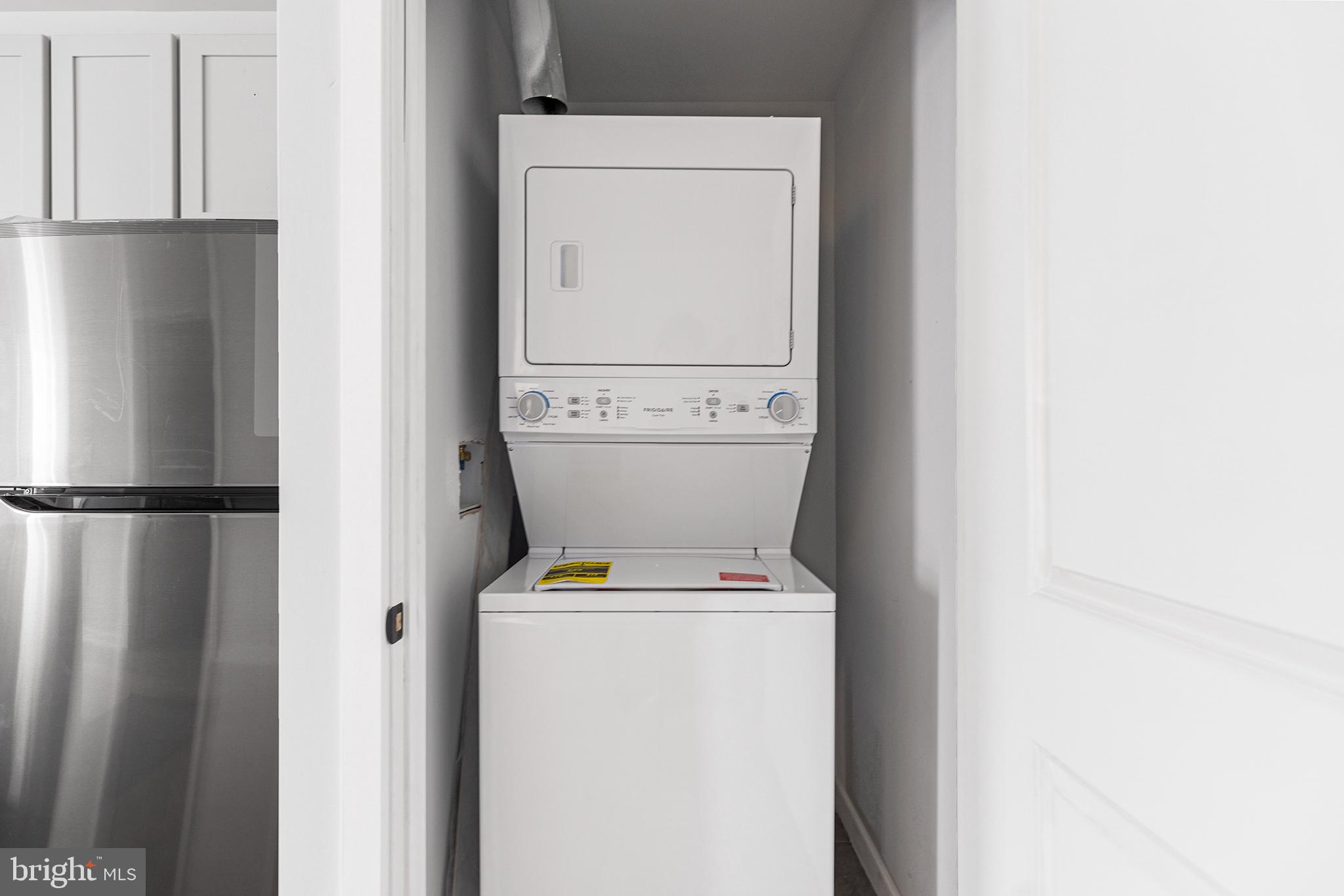 5542-44 Ridge Avenue, Unit 314 Philadelphia, PA 19128 - Photo 13 of 19 a utility room with dryer and washer