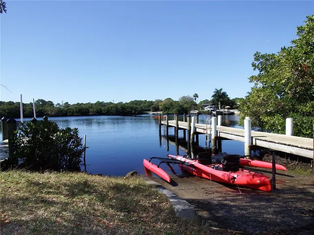 an aerial view of a house with a ocean view