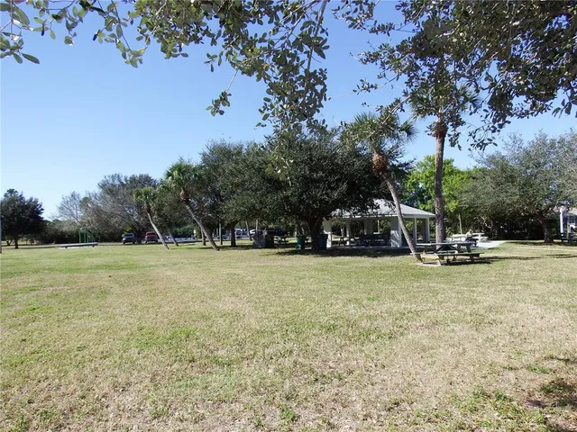 a view of balcony with wooden floor and outdoor seating