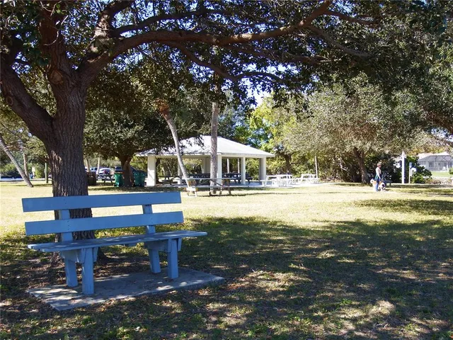 a view of a lake and yard in the back