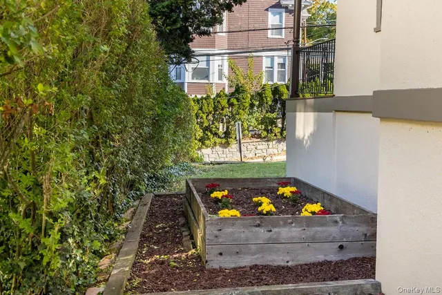 a backyard of a house with outdoor seating