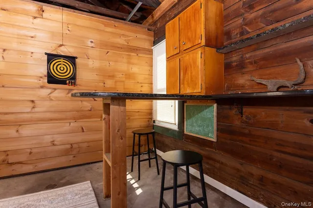 a view of a cars park in front of a building