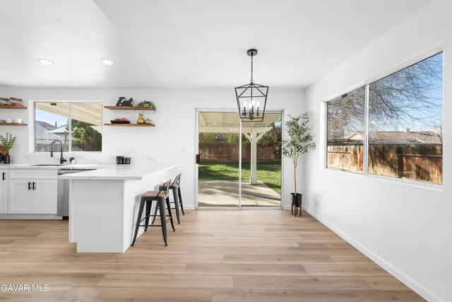 a open kitchen with a table and chairs