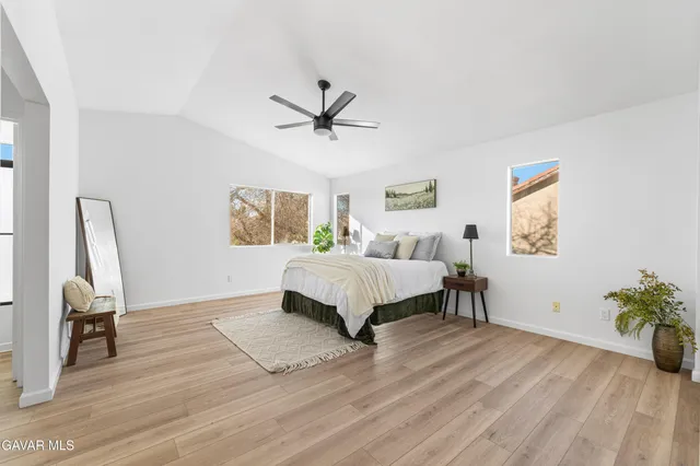 a bed room with a bed and a window